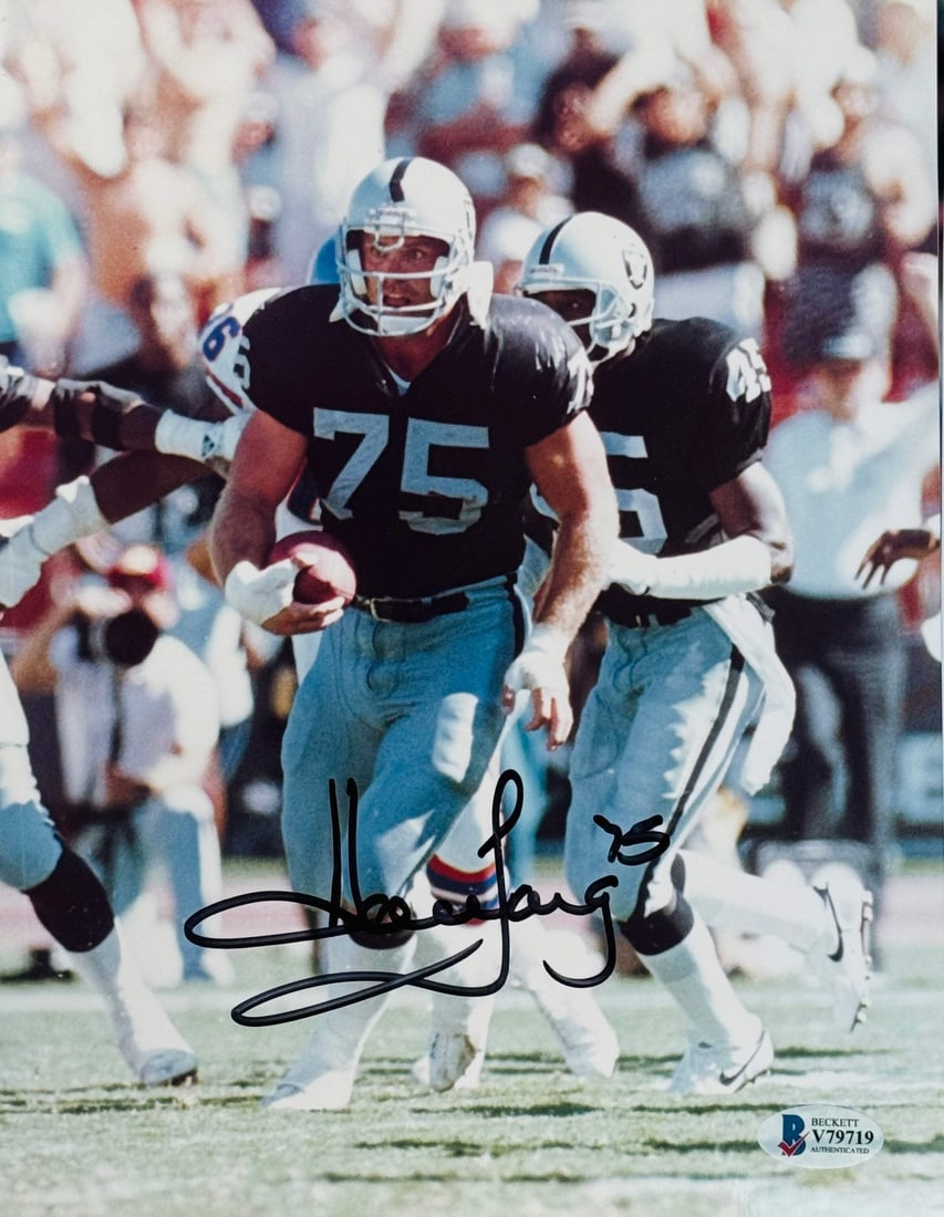 Howie Long Autographed 8x10 Football Photo (Beckett): Howie Long Autographed 8x10 Football Photo (Beckett) Signed in black sharpie by NFL legend Howie Long, this Beckett-graded 8x10 football photo showcases the iconic defensive end's signature across