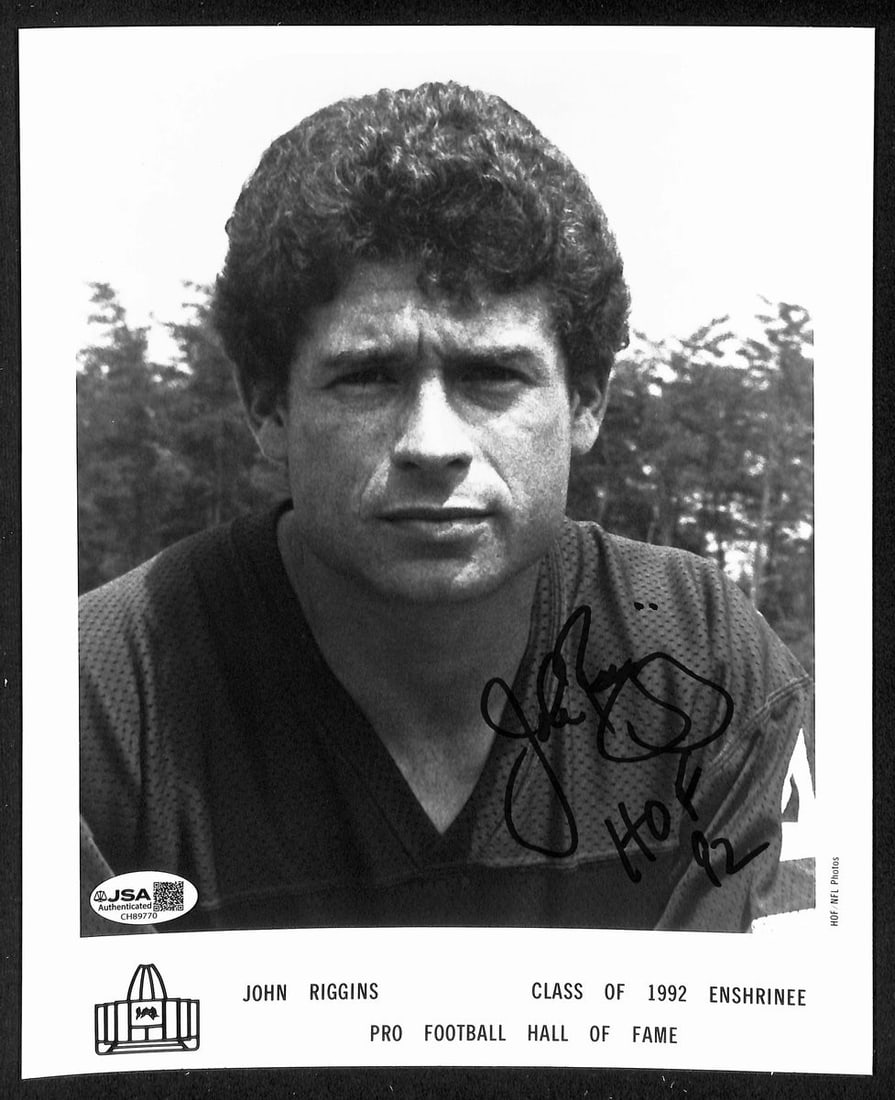 John Riggins Official Pro Football HOF Auto/ Signed 8x10 Photo JSA BA201961: John Riggins Official Pro Football HOF Auto/ Signed 8x10 Photo JSA BA201961 Authentic John Riggins Official Pro Football HOF Auto/ Signed 8x10 Photo, verified by the JSA (James Spence Authentication)