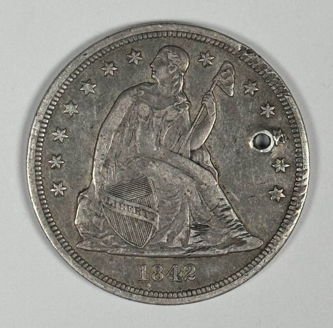 LIBERTY DOLLAR SEATED 1842 XF DETAILS: LIBERTY DOLLAR SEATED 1842 XF DETAILS Seated Liberty dollar coins from 1842 are highly sought after by collectors. This circulated example boasts XF details, showcasing its condition and age. The