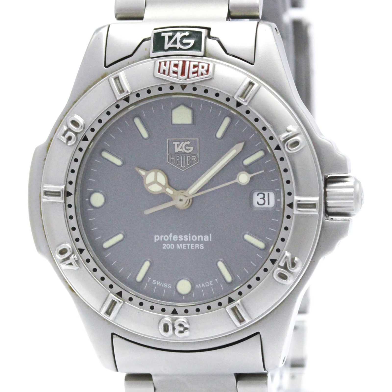 Wristwatch by Tag Heuer: Wristwatch by Tag Heuer Stainless steel case and band, the Tag Heuer Professional watch boasts a sleek gray dial. With its quartz movement and date function, this sporty timepiece is designed for ever