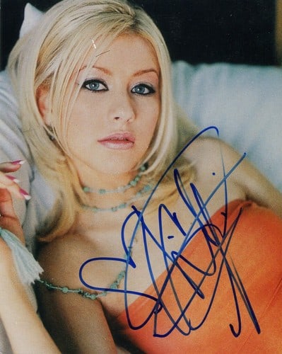 Christina Aguilera Autographed 8x10 Celebrity Photo: Christina Aguilera Autographed 8x10 Celebrity Photo Christina Aguilera's bold style shines through in this 8x10 celebrity photo, signed across the front in blue sharpie. The image captures her unique 