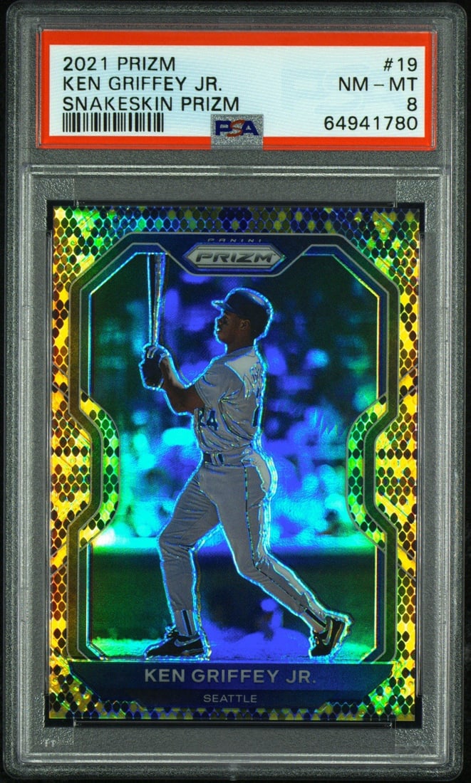 2021 PANINI PRIZM KEN GRIFFEY JR. #19 SNAKESKIN PRIZM/ 50 PSA 8: 2021 PANINI PRIZM KEN GRIFFEY JR. #19 SNAKESKIN PRIZM/ 50 PSA 8 2021 PANINI PRIZM KEN GRIFFEY JR. #19 SNAKESKIN PRIZM/ 50 PSA 8 - A Highly Refined Baseball Card.This card features Ken Griffey Jr., a l