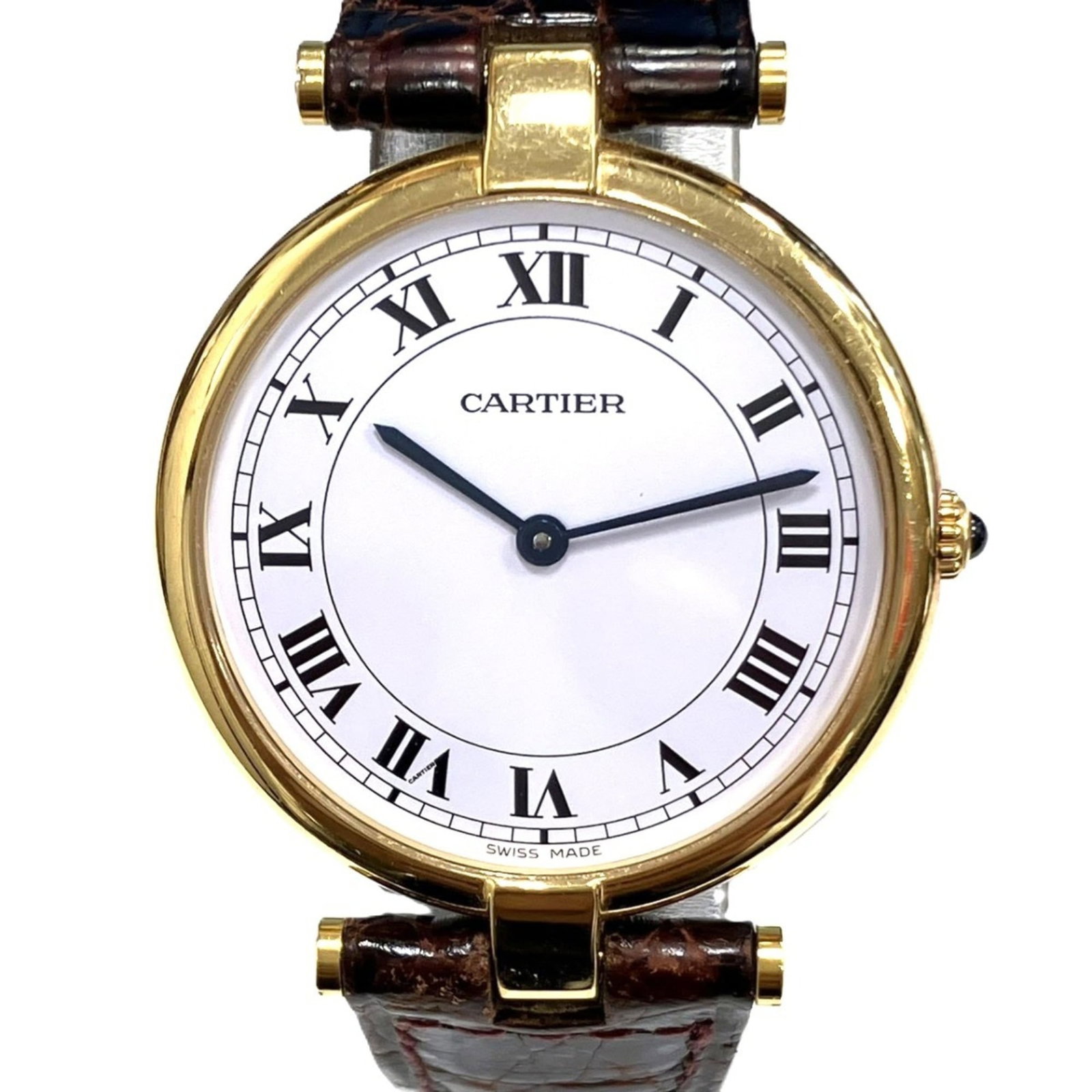 Cartier Wristwatch: Cartier Wristwatch Cartier's iconic wristwatch boasts an elegant 18K gold case and matching white dial, complemented by a supple leather band. Measuring 30mm in diameter, this quartz-powered timepiece