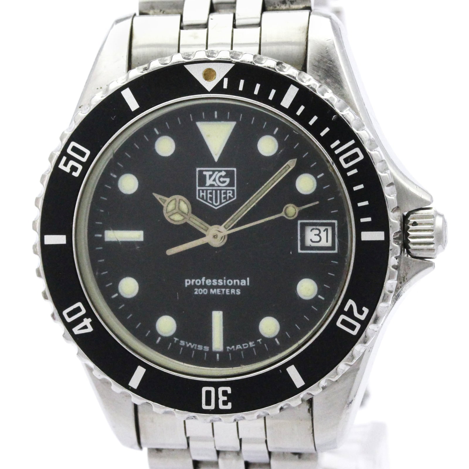 Wristwatch by Tag Heuer: Wristwatch by Tag Heuer Stainless steel case and band provide a sleek, sporty look for the Tag Heuer Professional watch. With its black dial and quartz movement, this timepiece keeps accurate time whi