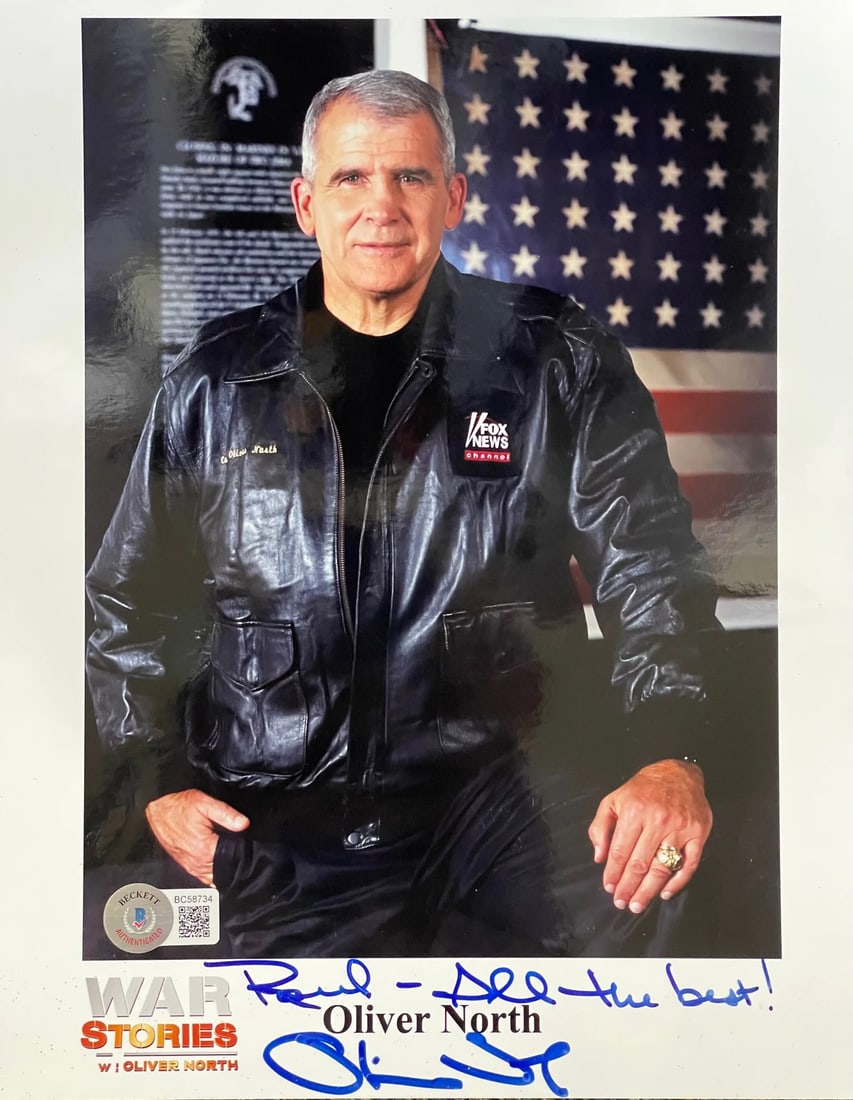 Oliver North Autographed 8x10 Photo (Beckett): Oliver North Autographed 8x10 Photo (Beckett) Oliver North's silver sharpie signature on the front of this 8x10 photo reads "Raul All The Best". The Beckett authentication ensures the legitimacy of