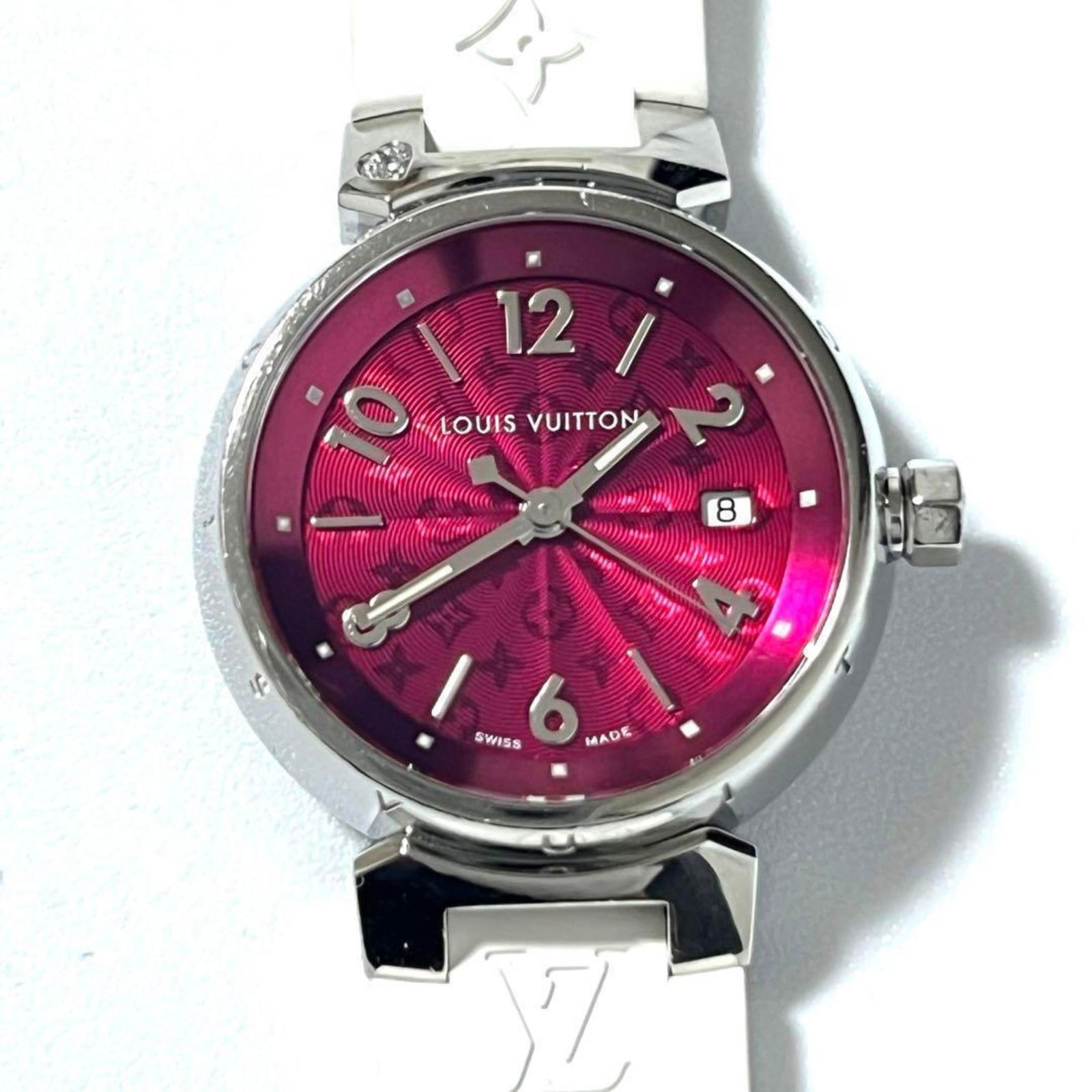 Louis Vuitton Wristwatch: Louis Vuitton Wristwatch Stainless steel case and rubber band provide a sleek, modern look for this Louis Vuitton wristwatch. The quartz movement ensures accurate timekeeping, while the inner and oute