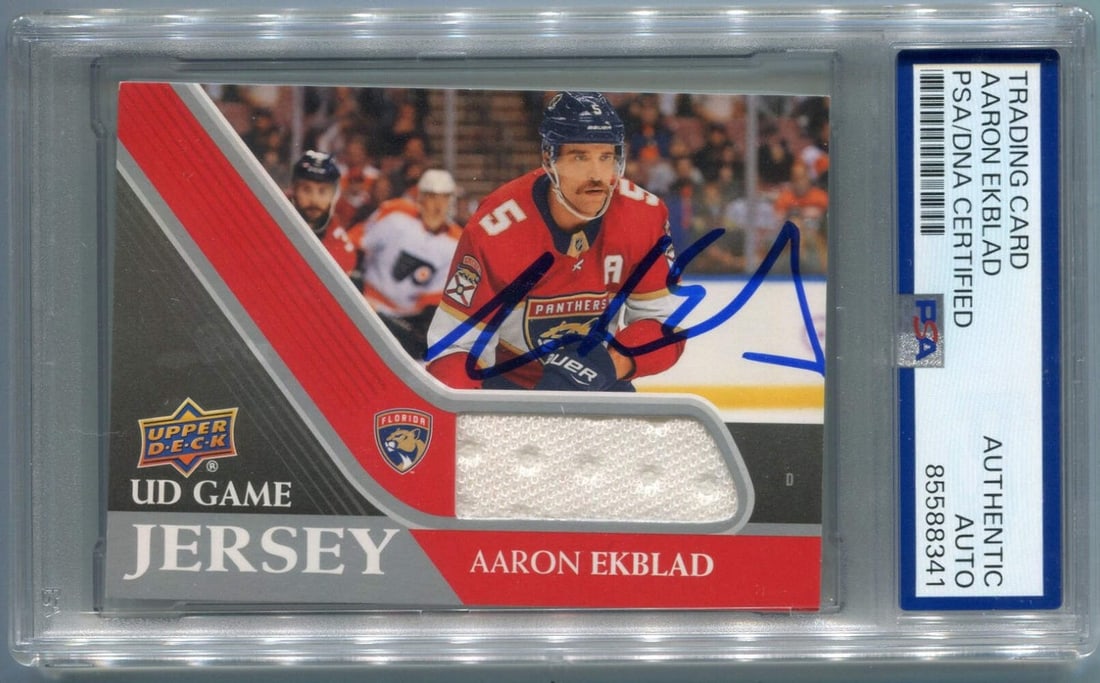 Aaron Ekblad Autographed 2020 - 2021 Upper Deck UD Game Jersey Card #GJ-AE PSA/ D: Aaron Ekblad Autographed 2020 - 2021 Upper Deck UD Game Jersey Card #GJ-AE PSA/ D Signed by Aaron Ekblad, this Upper Deck UD Game Jersey Card #GJ-AE features the Detroit Red Wings defenseman in his