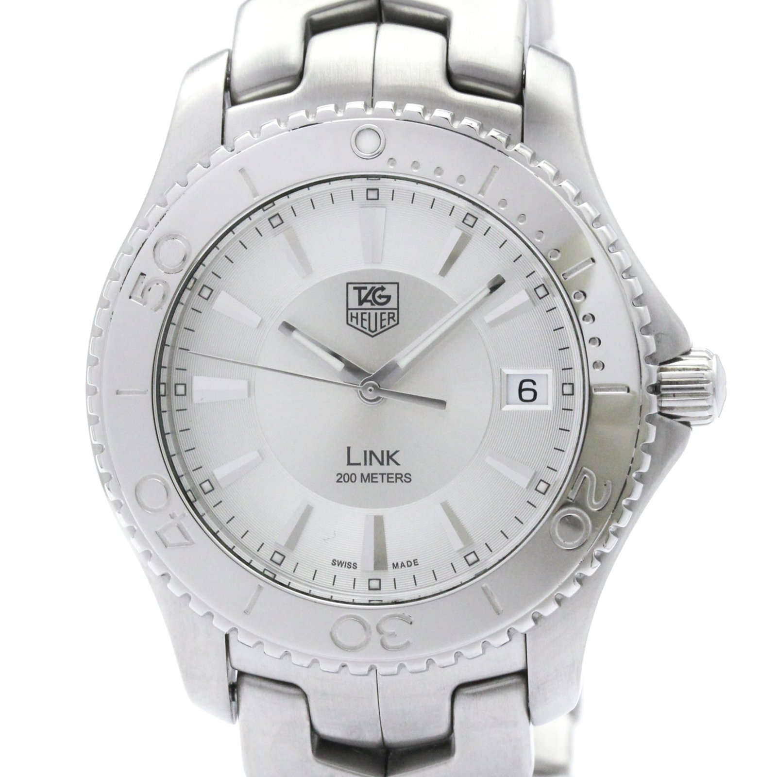 Wristwatch by Tag Heuer: Wristwatch by Tag Heuer Stainless steel case and band add a sporty touch to this Tag Heuer Link wristwatch, featuring a silver dial and quartz movement. The watch measures 39mm in diameter and weighs
