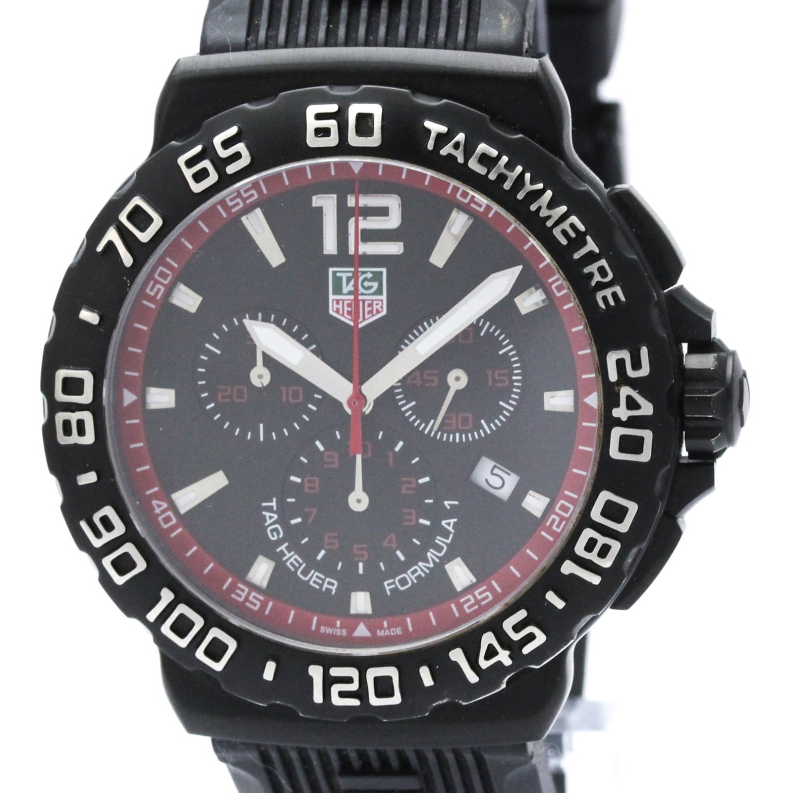Wristwatch by Tag Heuer: Wristwatch by Tag Heuer Stainless steel and rubber combine in the sleek design of this Tag Heuer Formula 1 wristwatch, featuring a black dial and quartz movement. The chronograph and date functions ma