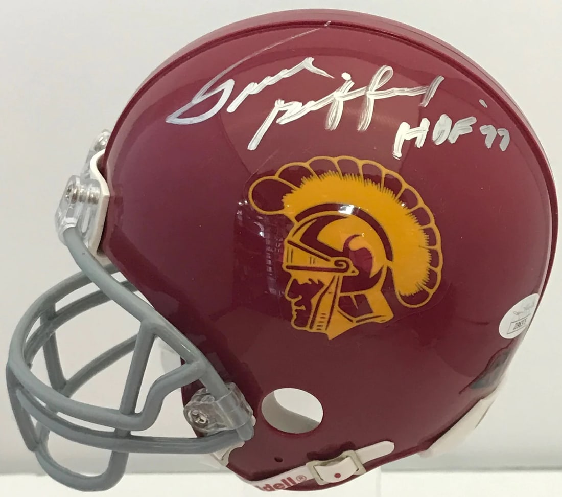 Frank Gifford Autographed USC Trojans Mini Helmet (JSA): Frank Gifford Autographed USC Trojans Mini Helmet (JSA) Signed in silver sharpie across the side of the helmet with inscription "HOF 77" by Frank Gifford, a legendary NFL player and member of the Pro 