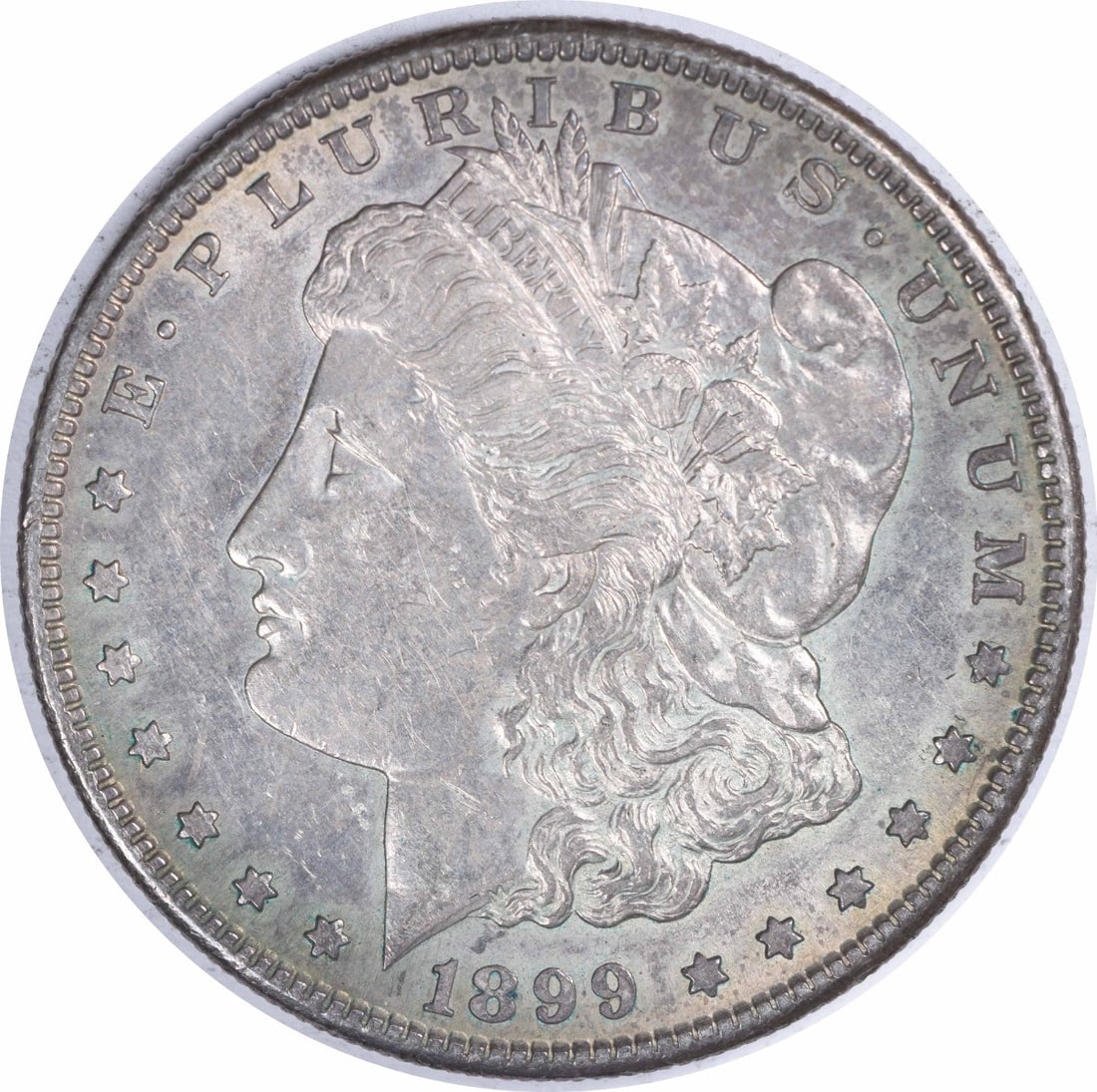 Morgan Silver Dollar AU Uncertified 1899-S: Morgan Silver Dollar AU Uncertified 1899-S The 1899-S Morgan Silver Dollar features a distinctive reeded edge and a mint mark indicating its origin from the San Francisco Mint. This circulated coin bo