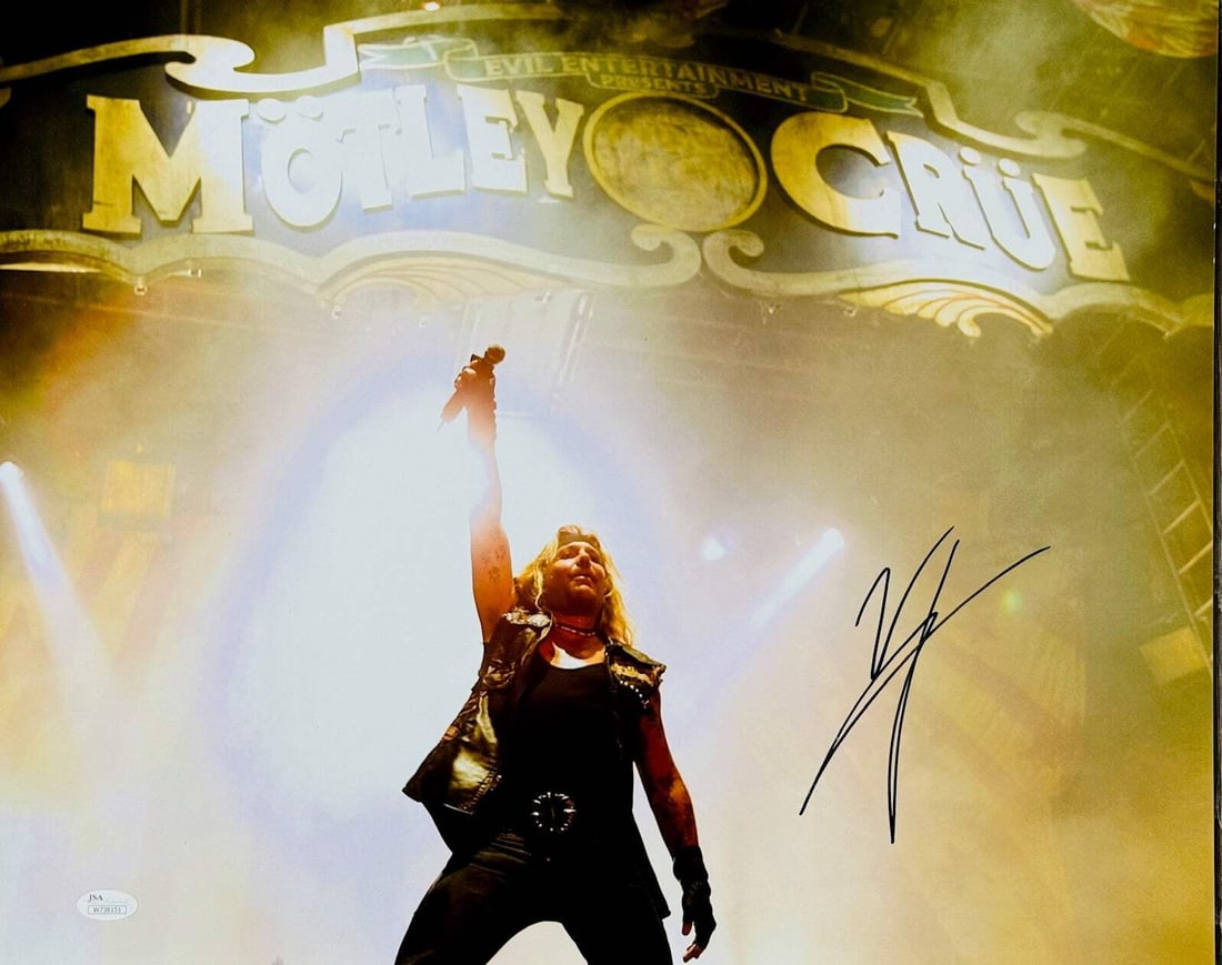 Vince Neil Autographed 16x20 Motley Crue Photo (JSA Witness): Vince Neil Autographed 16x20 Motley Crue Photo (JSA Witness) Vince Neil's sharpie signature across the front of this 16x20 Motley Crue photo captures a pivotal moment in concert, showcasing his energe
