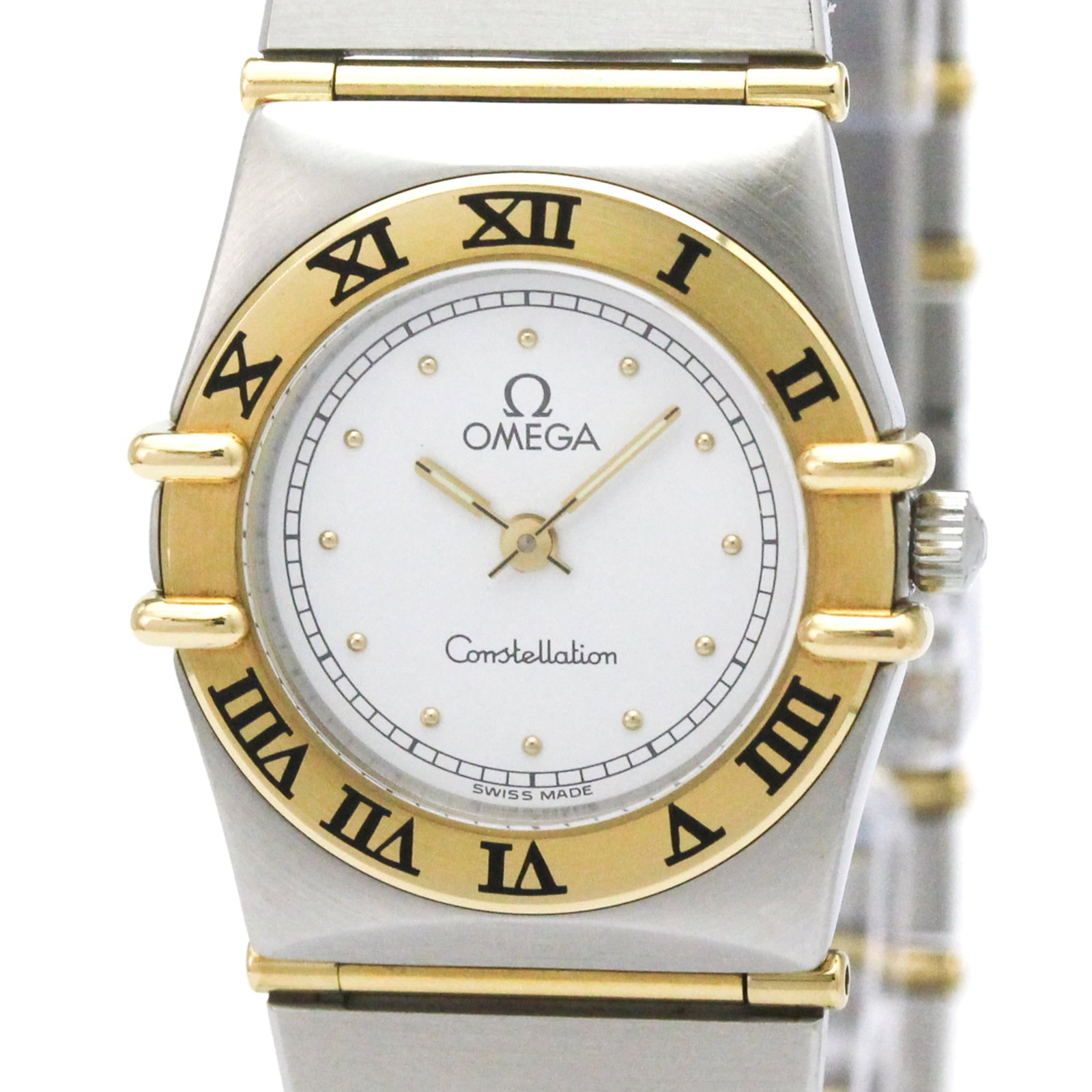 Omega Wristwatch: Omega Wristwatch Omega Constellation Wristwatch in Yellow Gold. This elegant timepiece boasts a stainless steel case and band, complemented by a gold dial, making it a stylish accessory for formal occ