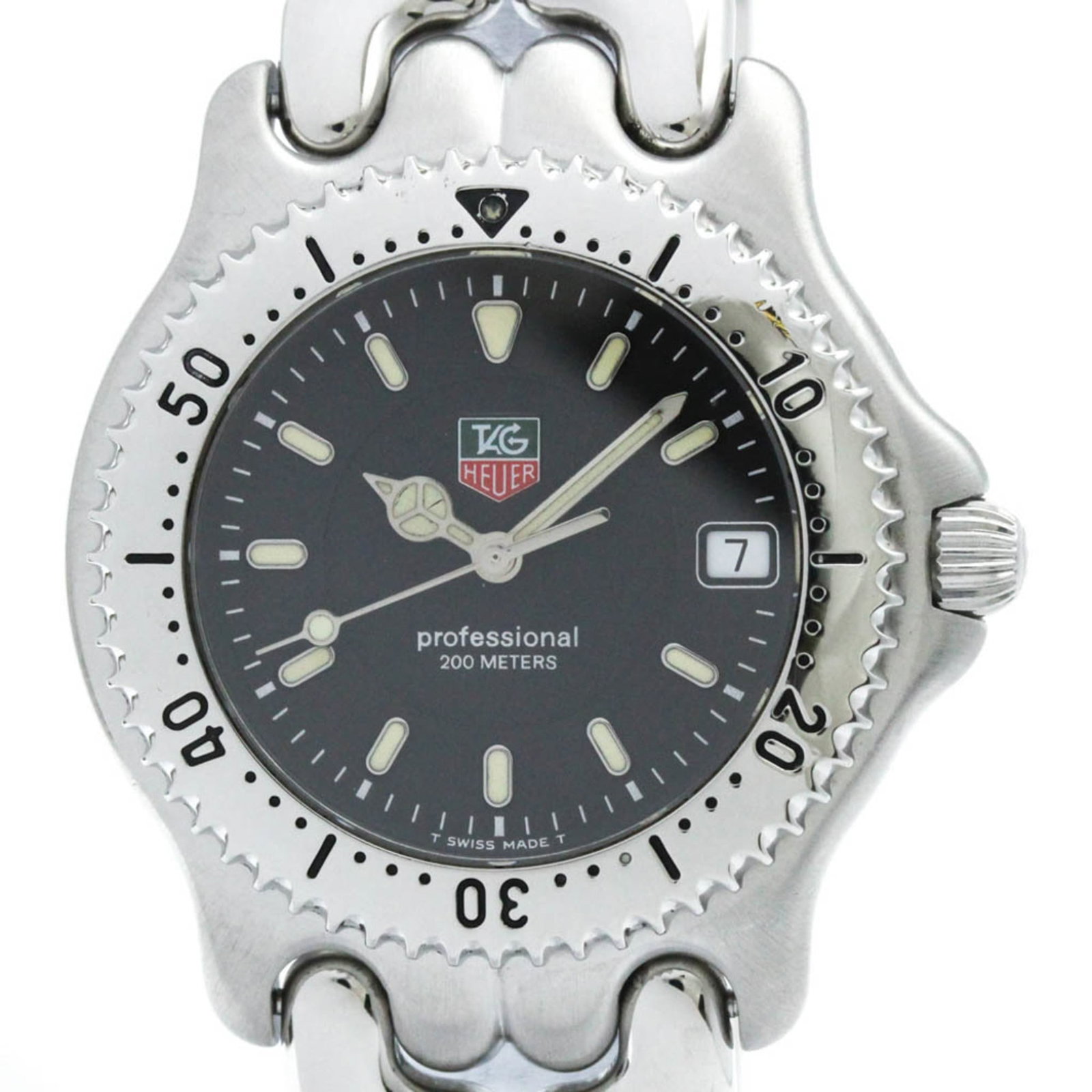 Wristwatch by Tag Heuer: Wristwatch by Tag Heuer Stainless steel case and band, this black dial Tag Heuer watch features a quartz movement and date display. The sleek design measures 38mm in diameter and weighs approximately 