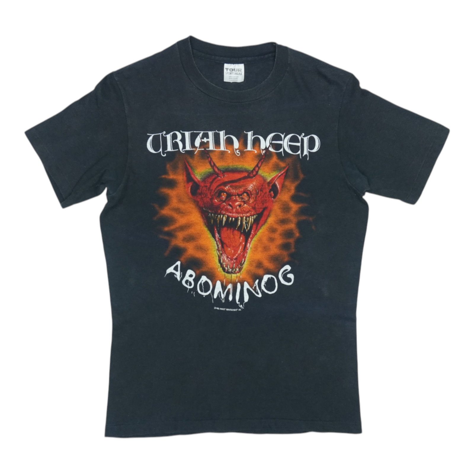 Abominog Uriah Heep Tour Shirt 1982: Abominog Uriah Heep Tour Shirt 1982 Authentic Abominog Uriah Heep Tour Shirt from 1982, featuring the iconic band's logo and tour graphics. This vintage tee has been carefully preserved to retain its 