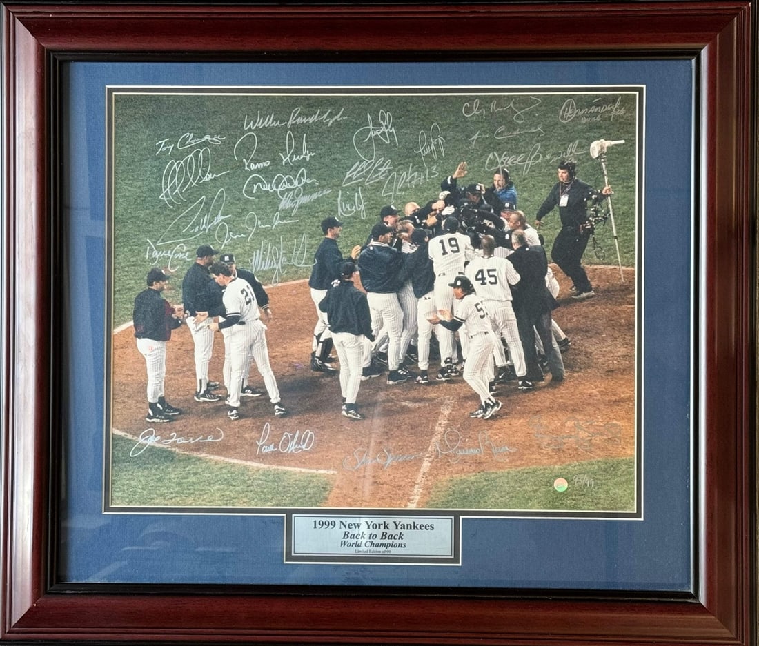 1999 New York Yankees World Series Champs Signed 16X20 Framed Photo #93/ 99 (Gold: 1999 New York Yankees World Series Champs Signed 16X20 Framed Photo #93/ 99 (Gold Signed by 25 former Yankees players in silver sharpie, this 16x20 framed photo commemorates the 1999 World Series Cham