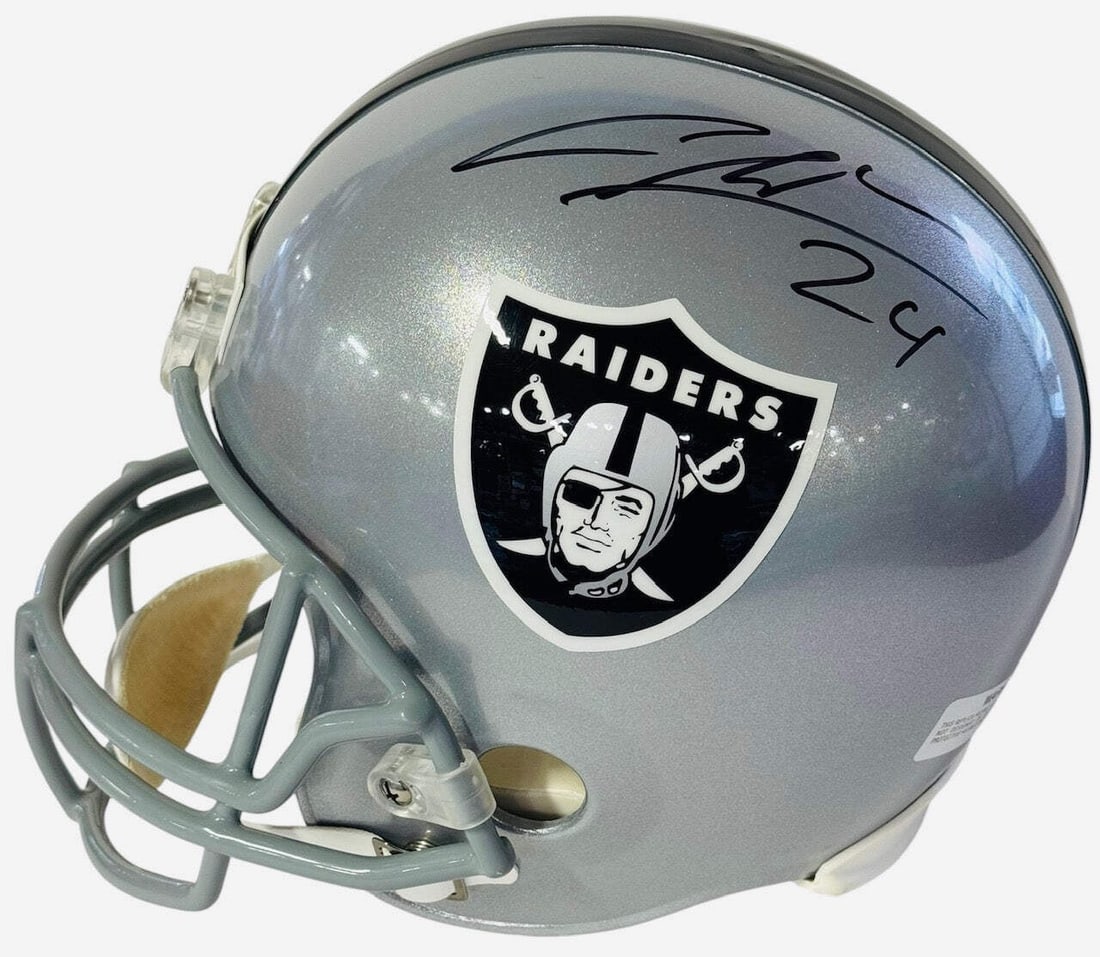 Charles Woodson Autographed Full Size Rep Oakland Raiders Helmet (PSA): Charles Woodson Autographed Full Size Rep Oakland Raiders Helmet (PSA) Signed in black sharpie across the side of the helmet, Charles Woodson's mark adds a touch of authenticity to this full-size