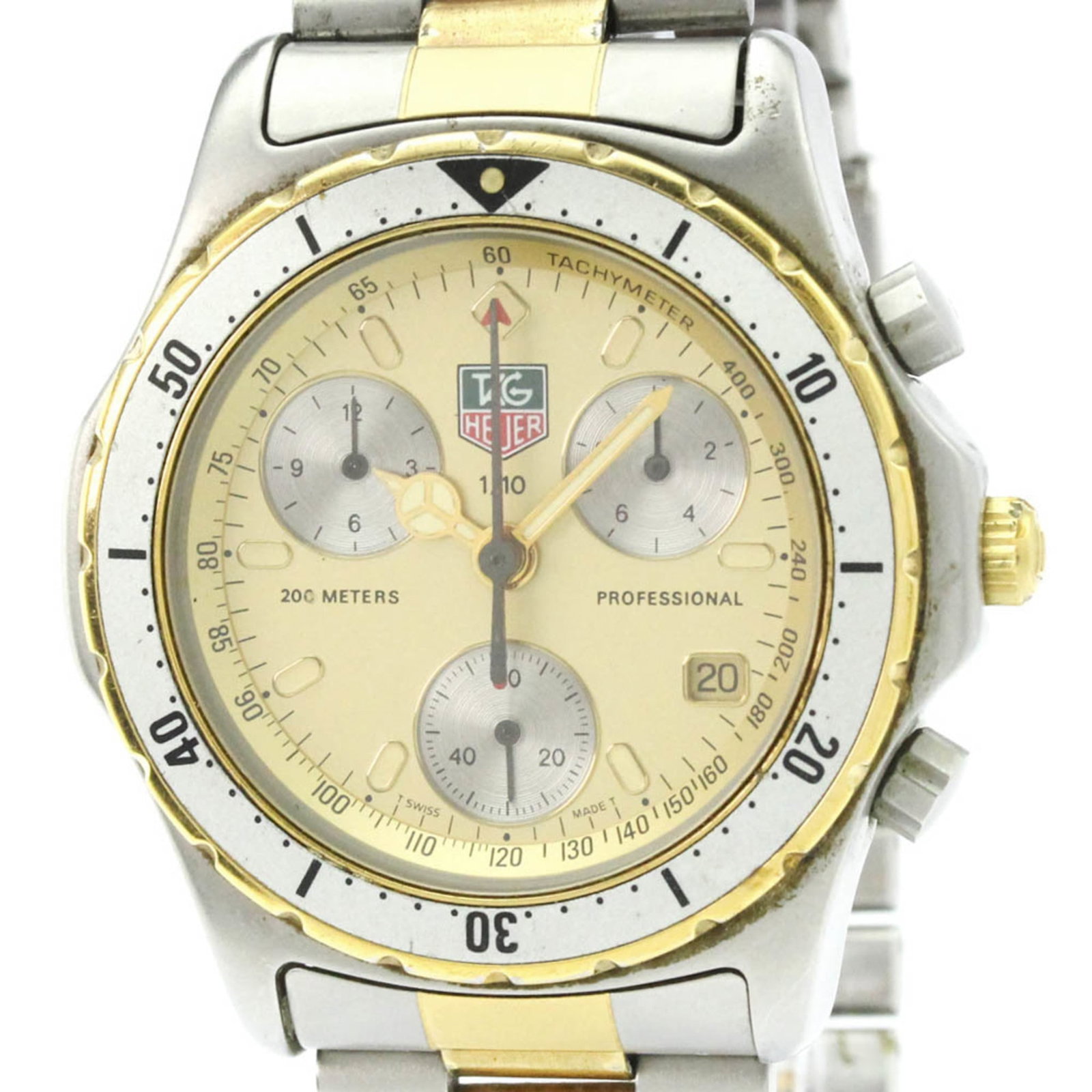 Wristwatch by Tag Heuer: Wristwatch by Tag Heuer The Tag Heuer Professional watch boasts a sleek, sporty design with a gold plated case and stainless steel band. Its quartz movement features chronograph and date functions,