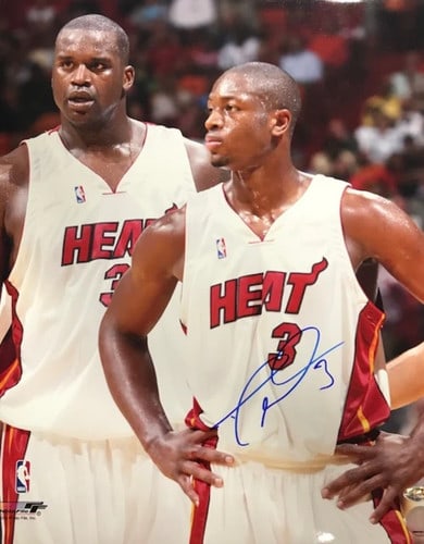 Autographed photo of Dwyane Wade and Shaquille O'Neal: Autographed photo of Dwyane Wade and Shaquille O'Neal Dwyane Wade and Shaquille O'Neal star together in this unique 16x20 photo, signed by both NBA legends in blue sharpie. The item comes with authent