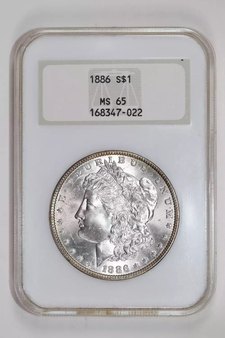 1886 MORGAN DOLLAR NGC MS65 OLD FATTY HOLDER LOOKS NICER: 1886 MORGAN DOLLAR NGC MS65 OLD FATTY HOLDER LOOKS NICER The 1886 Morgan Dollar, graded MS65 by the Numismatic Guaranty Corporation (NGC), boasts an impressive silver composition and a circulated unci