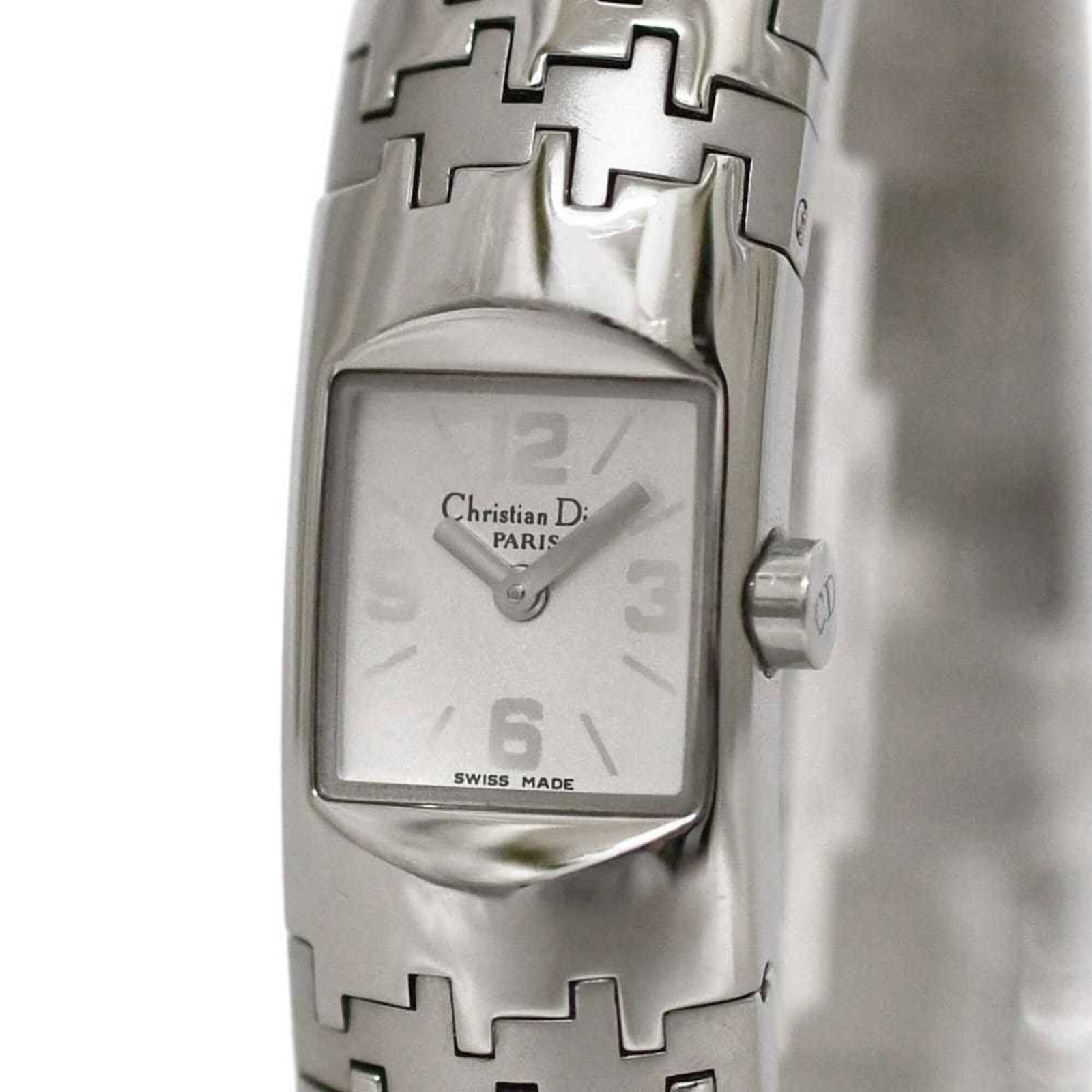 Wristwatch by Christian Dior: Wristwatch by Christian Dior Stainless steel case and band add a sleek touch to this white quartz wristwatch by Christian Dior, measuring just 15.2mm in diameter. Designed for women with a wrist size