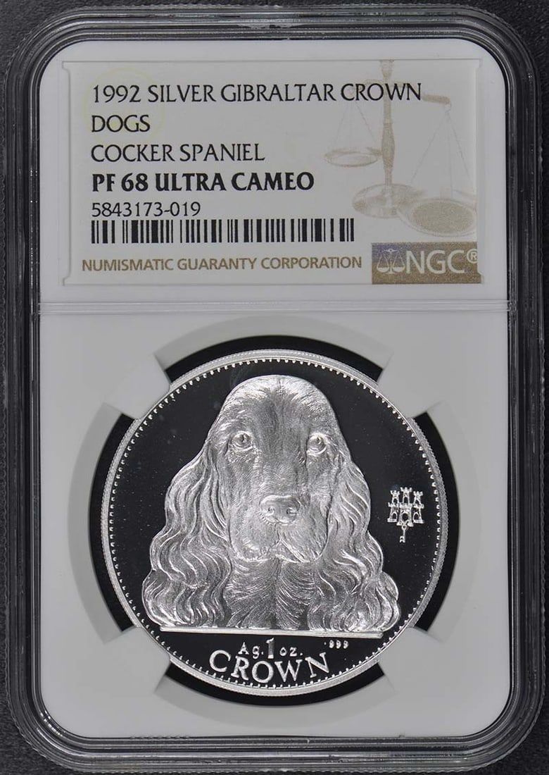 1992 Silver Gibraltar Crown Dog Cocker Spaniel NGC PF68 UC: 1992 Silver Gibraltar Crown Dog Cocker Spaniel NGC PF68 UC The 1992 Silver Gibraltar Crown Dog Cocker Spaniel is an uncirculated coin featuring a beautifully rendered image of the breed, with its dist