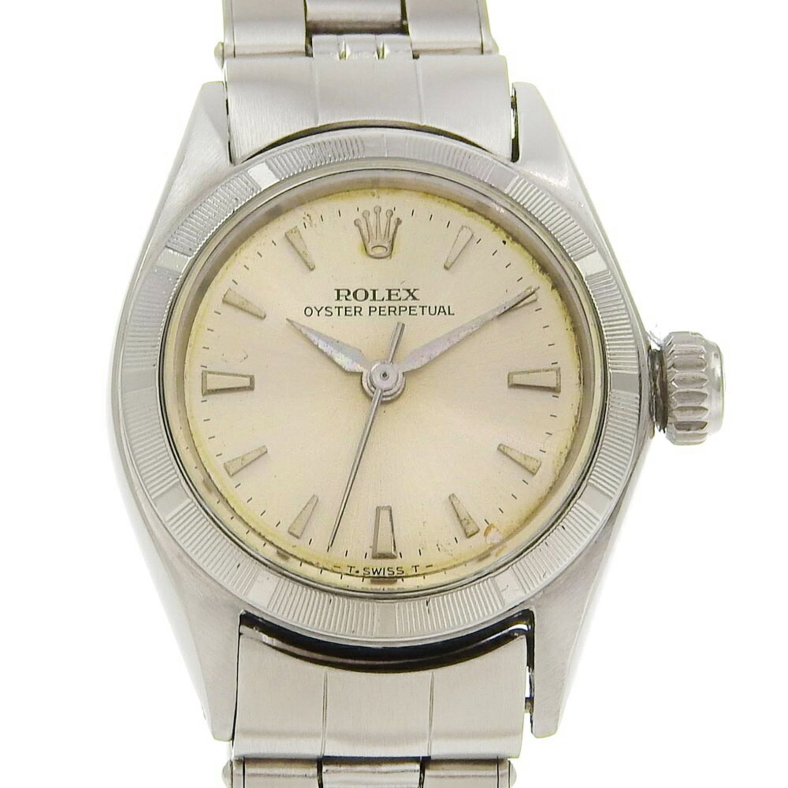 Rolex Wristwatch: Rolex Wristwatch Stainless steel case and band provide a sleek, modern look for the woman's wrist. The silver dial features a self-winding automatic movement, adding a touch of sophistication to this 