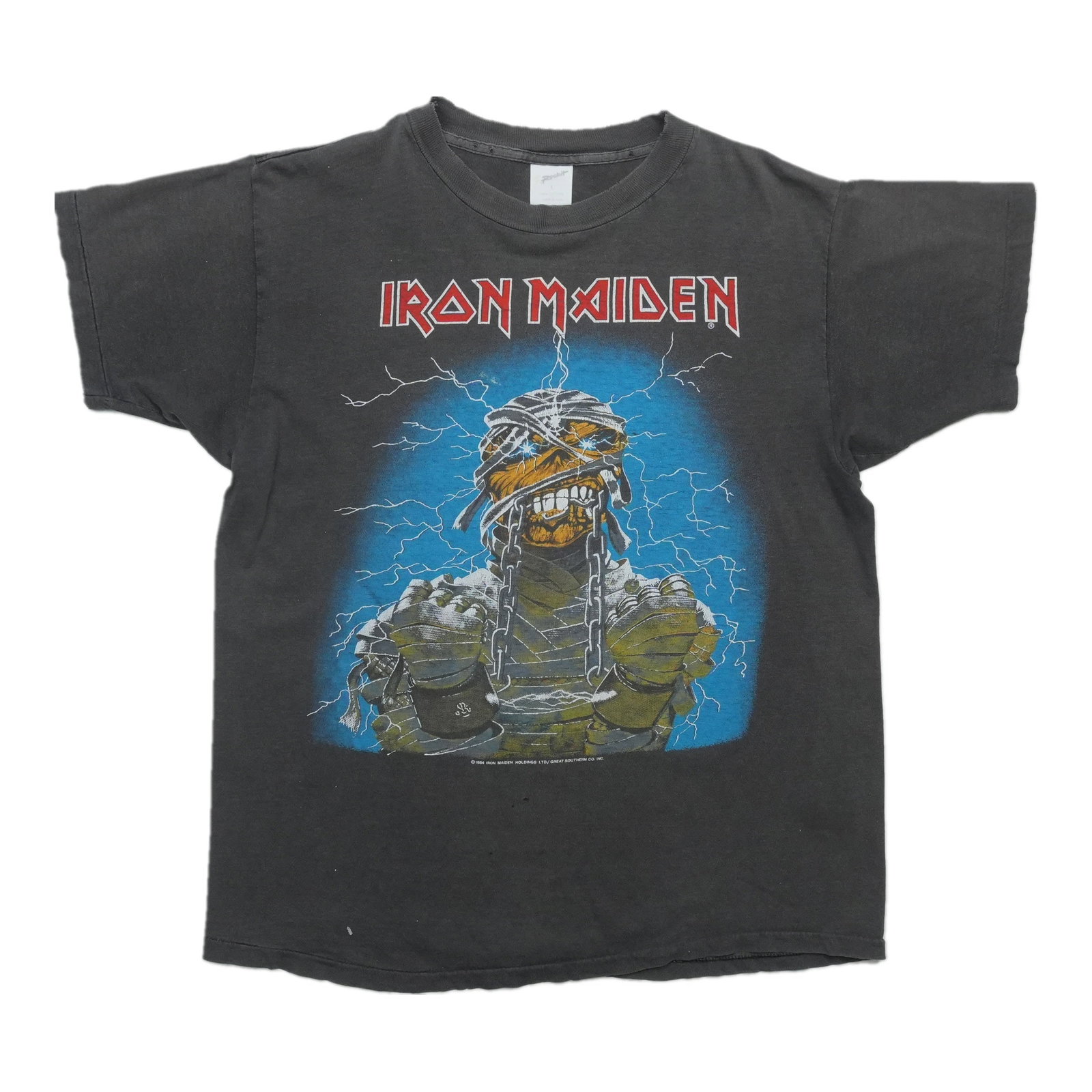 Iron Maiden World Slavery Tour Shirt: Iron Maiden World Slavery Tour Shirt Iron Maiden's iconic World Slavery Tour Shirt, featuring the band's signature ironwork design and bold graphics, is a must-have for fans of the legendary metal gro