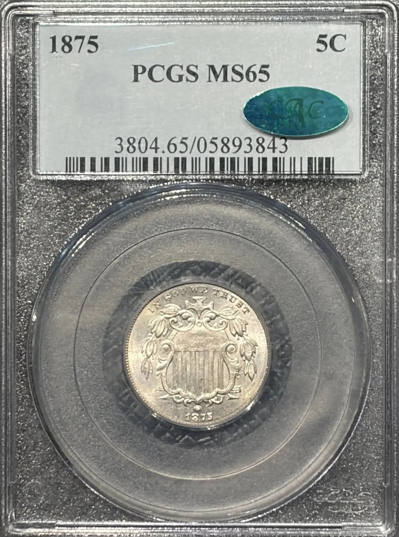 1875 SHIELD NICKEL PCGS MS65 CAC - VERY PQ: 1875 SHIELD NICKEL PCGS MS65 CAC - VERY PQ 1875 Shield Nickel PCGS MS65 CAC - VERY PQ. This highly graded 1875 Shield Nickel, certified by both PCGS and CAC, boasts a stunning MS65 grade, showcasing e