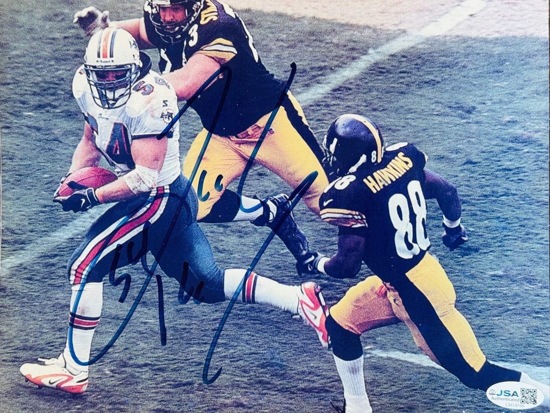 Zach Thomas Autographed Dolphins 8x10 Football Photo (JSA): Zach Thomas Autographed Dolphins 8x10 Football Photo (JSA) Zach Thomas' sharpie signature adds a touch of authenticity to this official 8x10 football photo, capturing the Dolphins linebacker in action