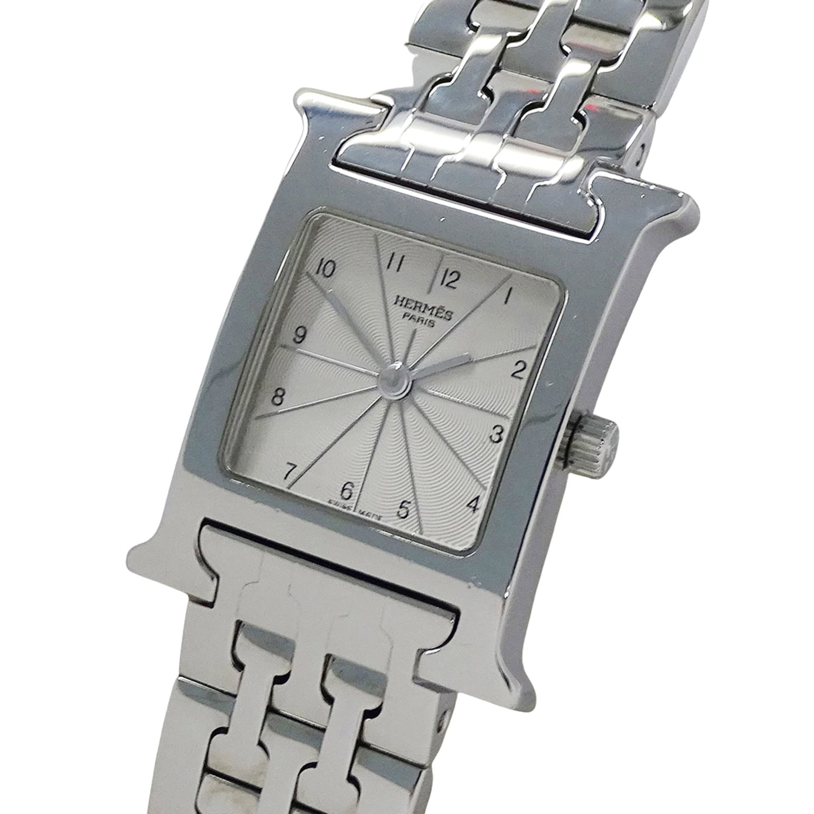 Hermes Wristwatch: Hermes Wristwatch Stainless steel case and band, the Hermes wristwatch exudes understated elegance with its ivory dial. This quartz movement timepiece boasts a sleek design, measuring 21mm in