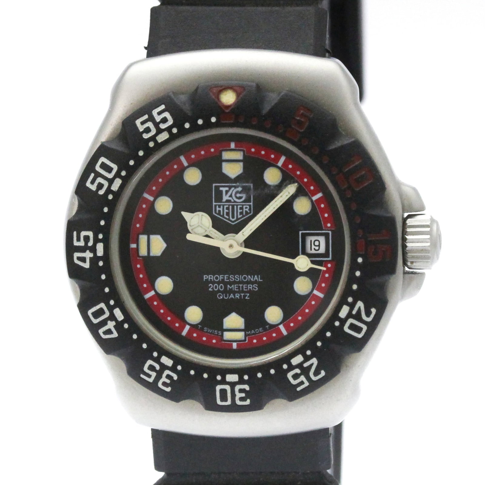 Wristwatch by Tag Heuer: Wristwatch by Tag Heuer Stainless steel case and rubber band provide a sporty look, while the black dial adds a sleek touch to this Tag Heuer Formula 1 wristwatch. This quartz watch features date func