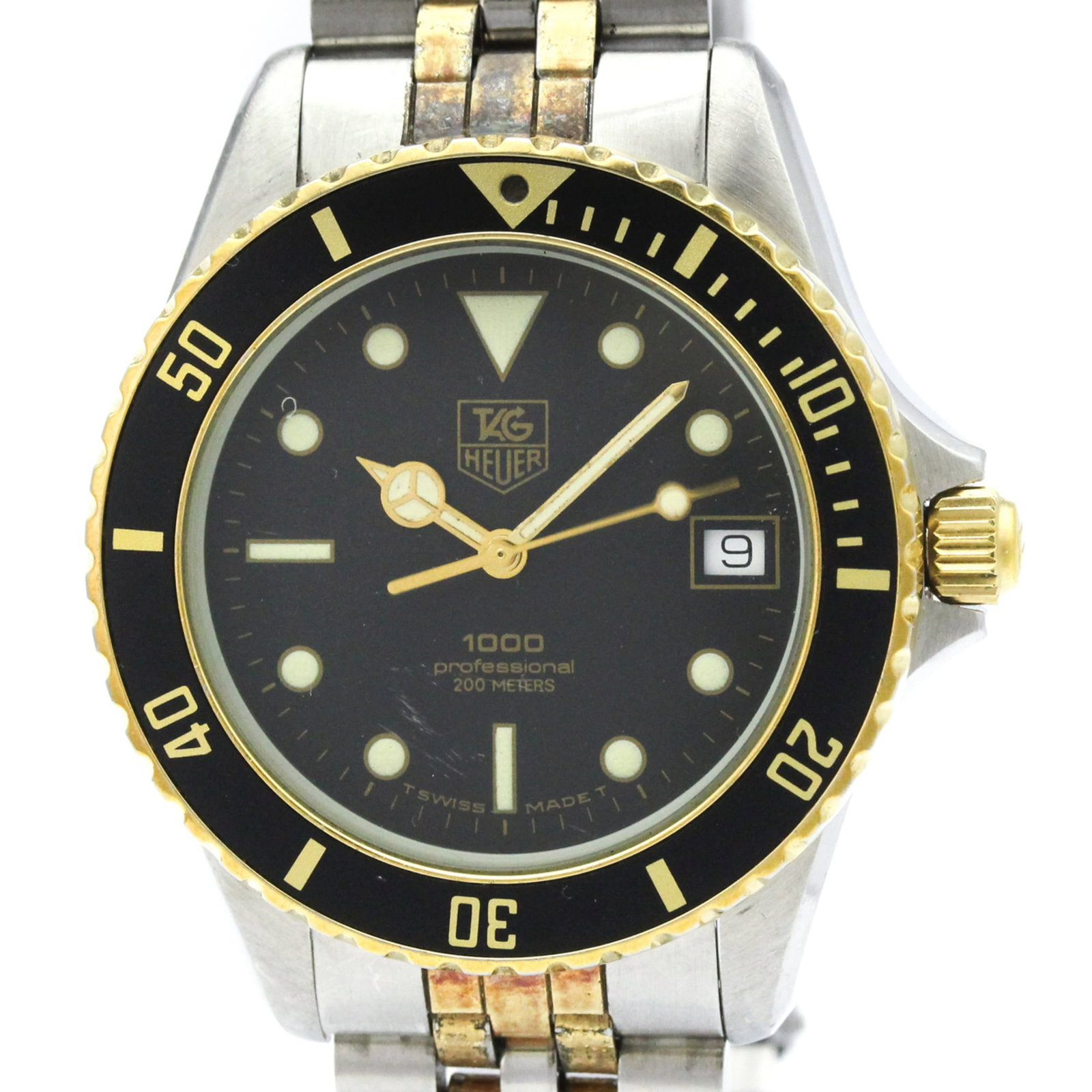 Wristwatch by Tag Heuer: Wristwatch by Tag Heuer Tag Heuer's Professional model wristwatch boasts a sleek, sporty design with a black dial and gold plated case and band. The quartz movement keeps accurate time, while the