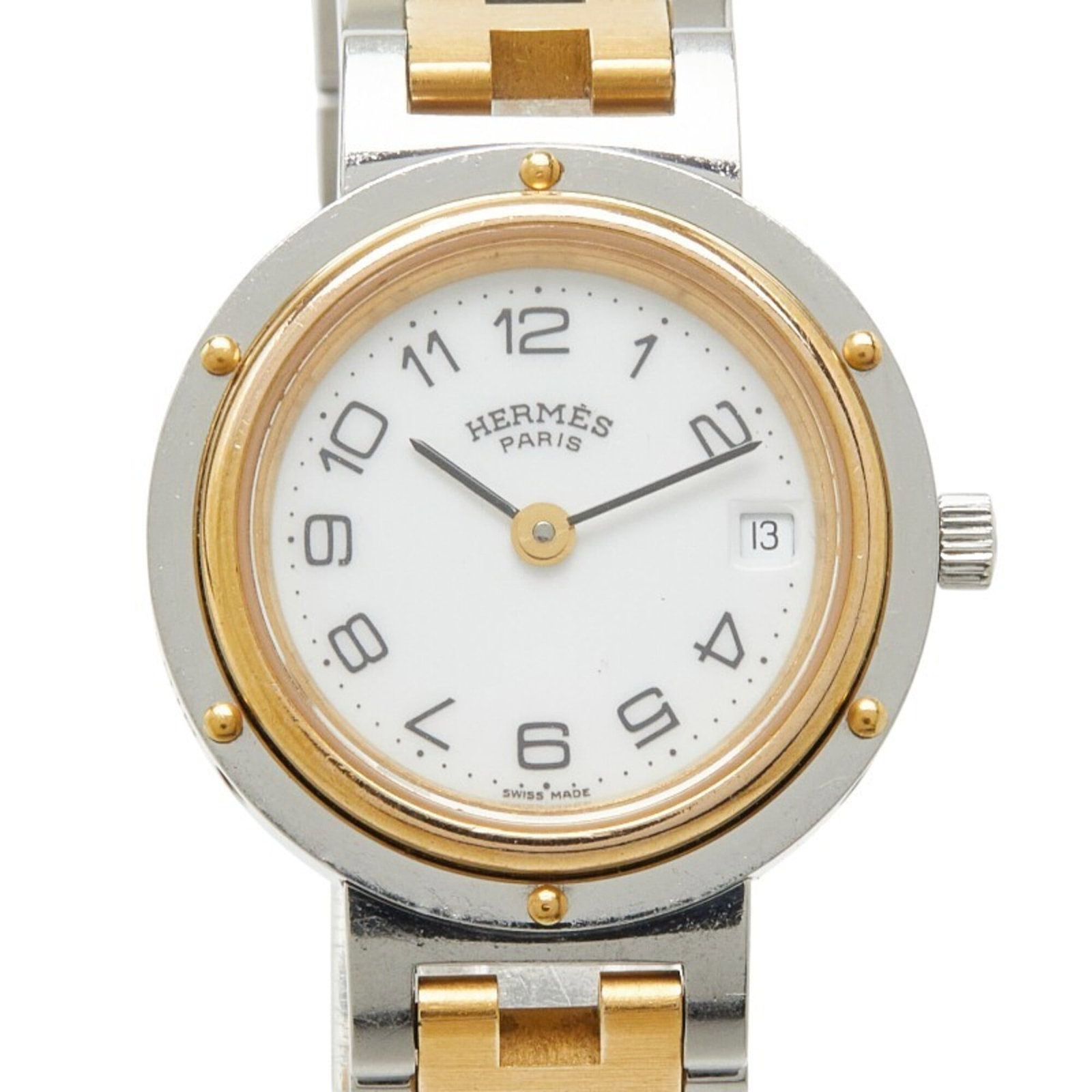 Hermes Wristwatch: Hermes Wristwatch Stainless steel case and band provide a sleek, modern look for women. The quartz movement keeps time with precision, while the white dial adds a touch of elegance to this 24mm wristw