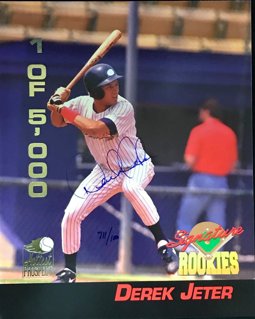 Derek Jeter Signed 8x10 Baseball Photo (JSA): Derek Jeter Signed 8x10 Baseball Photo (JSA) Signed by Derek Jeter in blue sharpie, this official 8x10 photo features the iconic New York Yankees shortstop. The James Spence Authentication (JSA) logo 