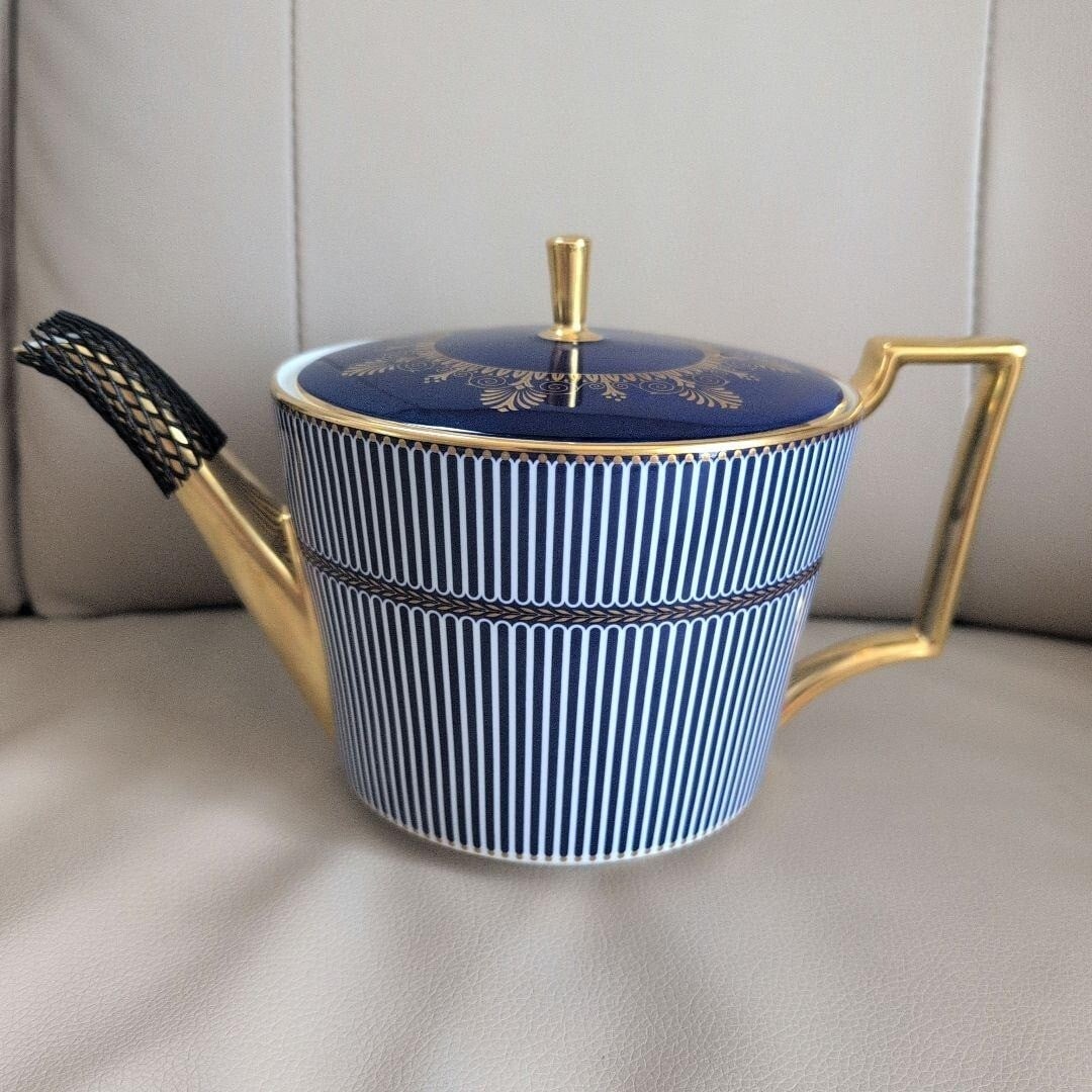 Bone china tableware with gold trim elegant blue teapot from British Wedgwood: Bone china tableware with gold trim elegant blue teapot from British Wedgwood Item Specifics: Brand: Wedgwood Product Disclaimer: Measurements approximate; colors may vary due to lighting. While we st