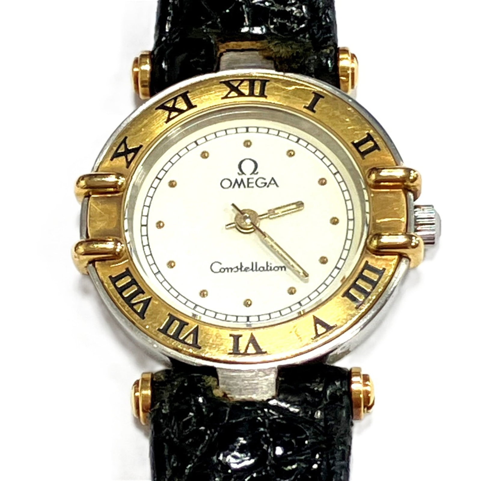 Omega Wristwatch: Omega Wristwatch Gold plated, stainless steel case and leather band make this Omega wristwatch a stylish accessory. The quartz movement powers the watch's white dial, which sits atop a 23mm gold plate