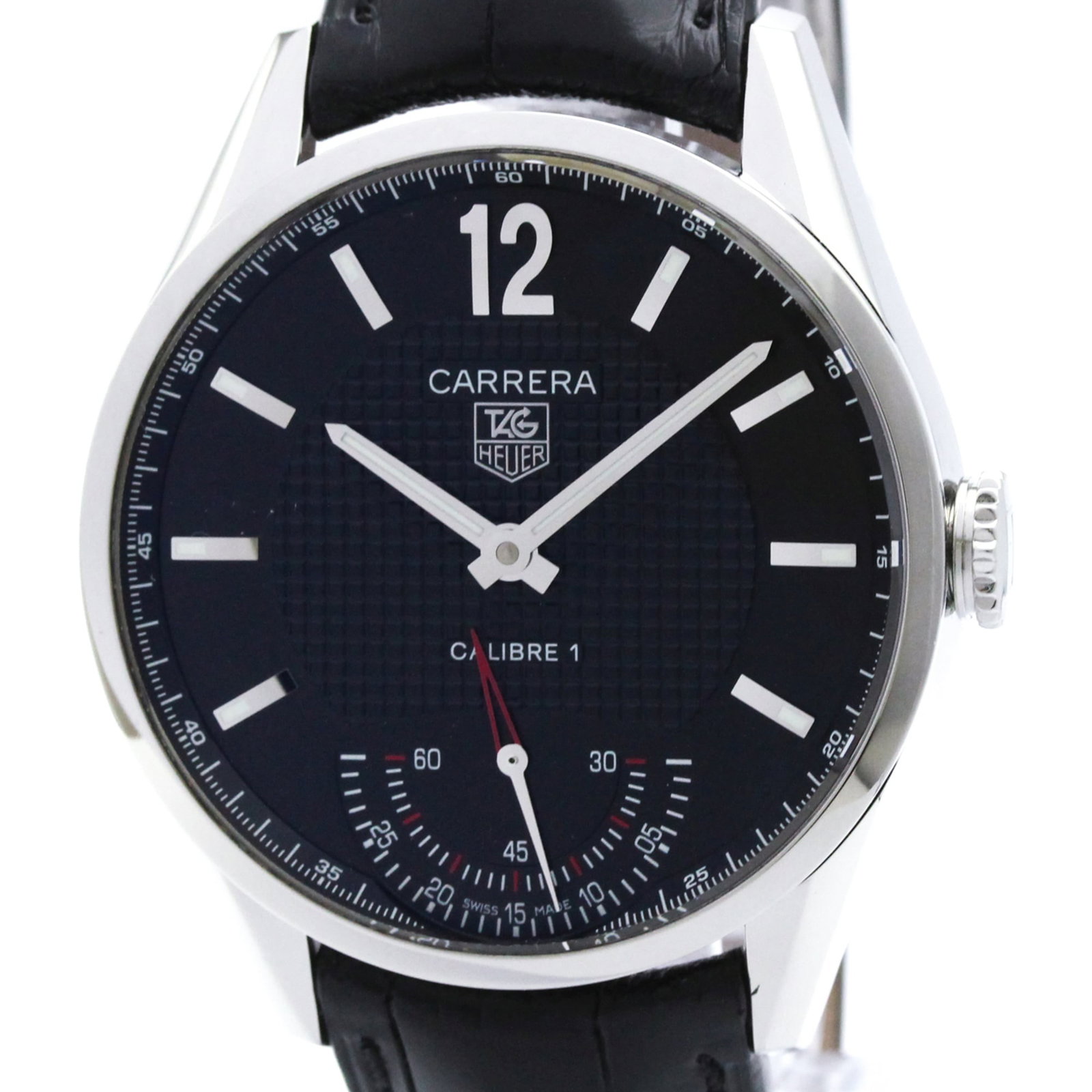 Wristwatch by Tag Heuer: Wristwatch by Tag Heuer Stainless steel and leather come together in the sleek design of this Tag Heuer Carrera wristwatch, featuring a black dial and manual winding mechanical movement. With its