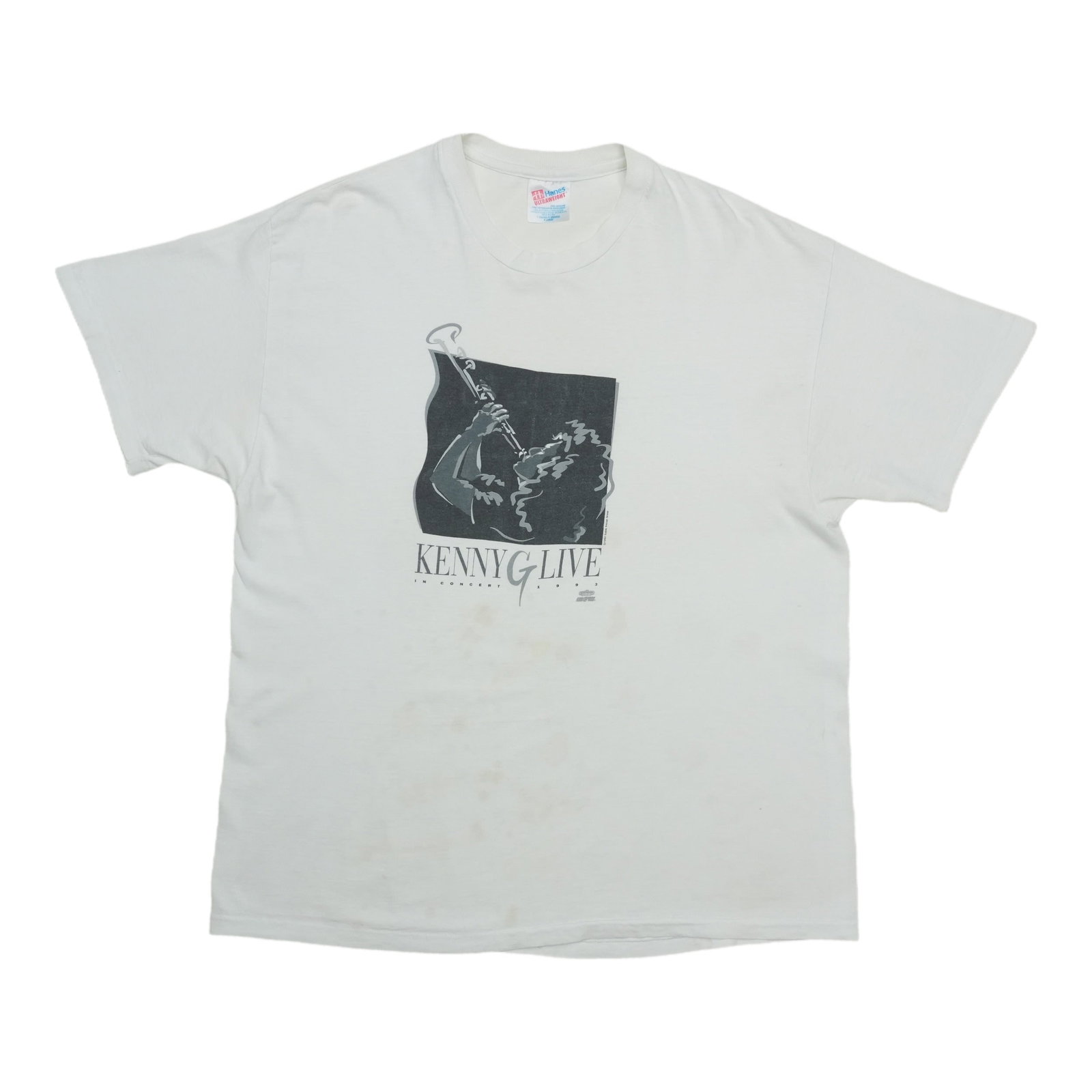 1990s Kenny G Live In Concert Shirt: 1990s Kenny G Live In Concert Shirt Authentic Kenny G Live In Concert Shirt from the 1990s, featuring bold graphics and vibrant colors that evoke the smooth jazz era. This rare item is a must-have for