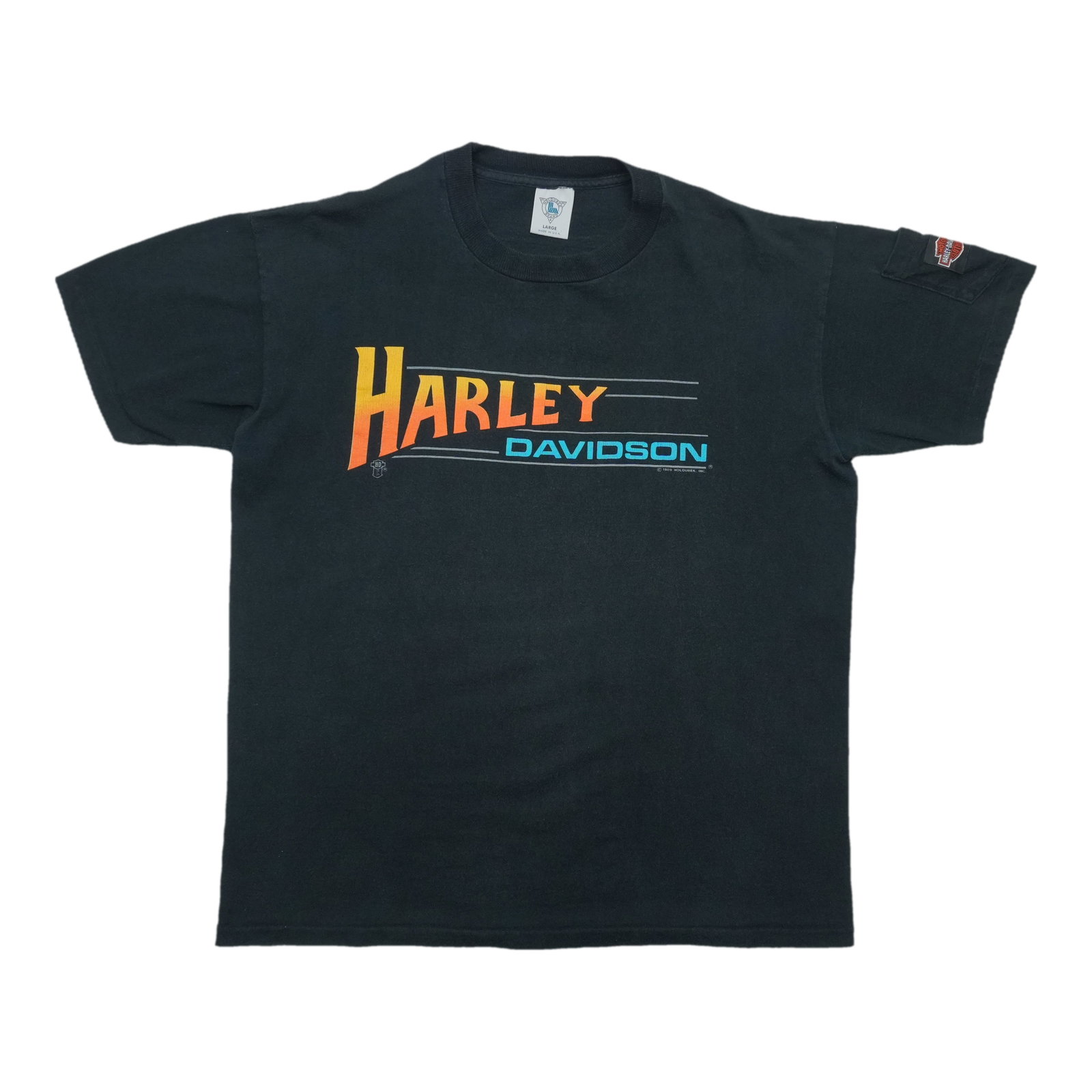 Harley Davidson 1989 Shirt City Kansas: Harley Davidson 1989 Shirt City Kansas Authentic Harley Davidson 1989 Shirt from City Kansas, bearing the iconic logo and design. This vintage shirt is a nostalgic piece for motorcycle enthusiasts
