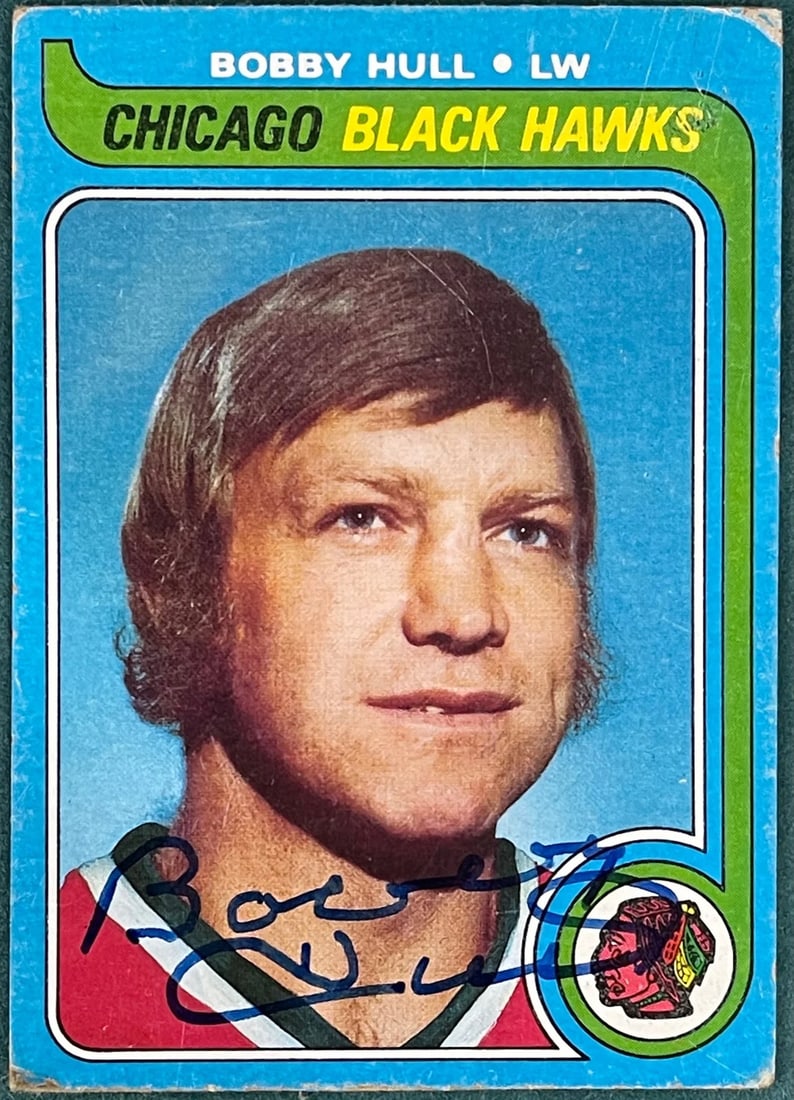 Bobby Hull autographed card 1979-80 Topps: Bobby Hull autographed card 1979-80 Topps Bobby Hull's signature on the front of this 1979-80 Topps card #185 is unmistakable, bearing across the card in blue sharpie. The card itself features a