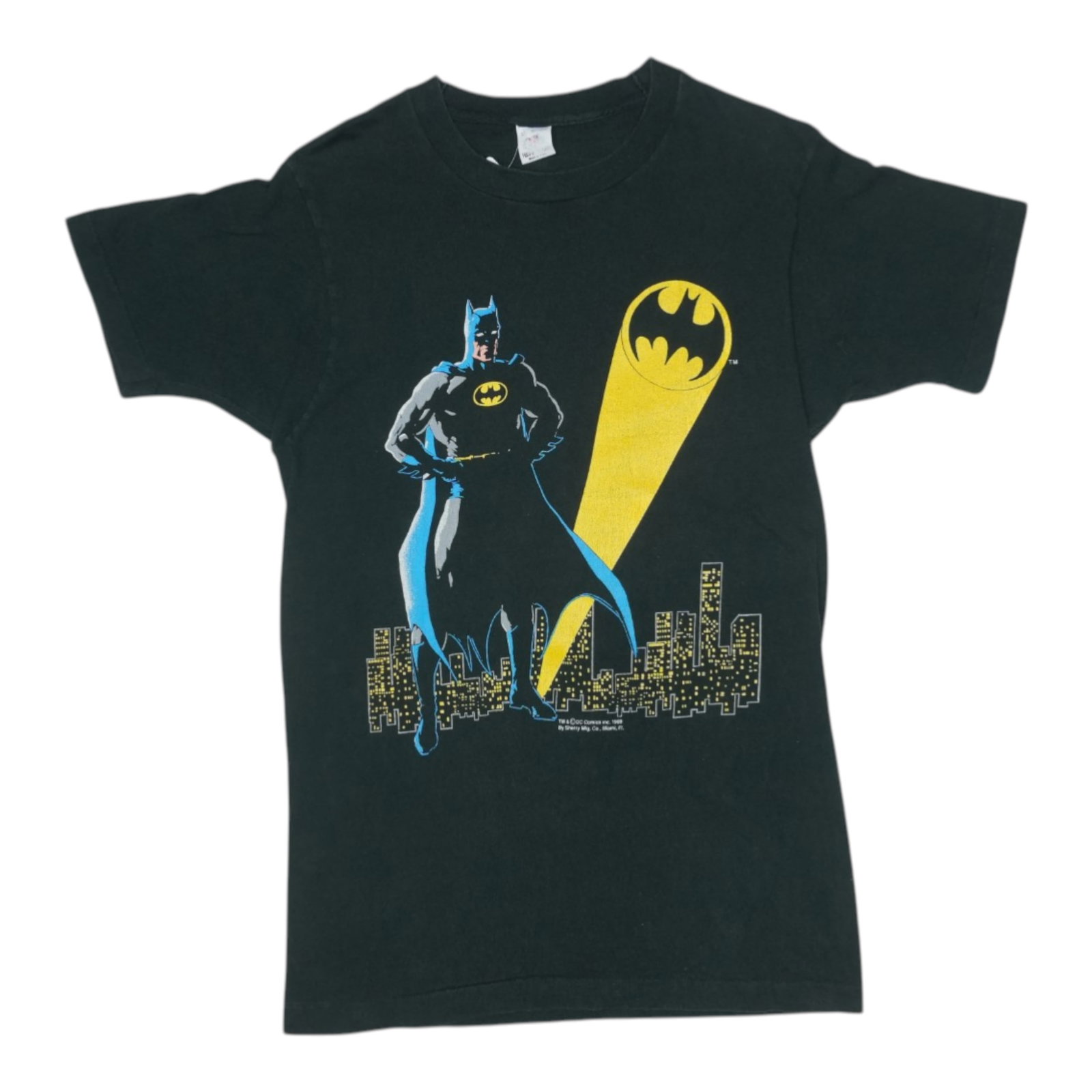 1989 Batman DC Comics Shirt: 1989 Batman DC Comics Shirt Iconic 80s fashion meets Caped Crusader style in this vintage 1989 Batman DC Comics shirt. Featuring the beloved superhero's logo and colors, this retro tee is perfect for 