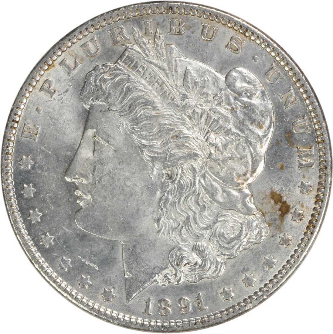 1891 Morgan Silver Dollar AU Slider Uncertified: 1891 Morgan Silver Dollar AU Slider Uncertified The 1891 Morgan Silver Dollar features an AU grade, indicating a high level of detail and luster. With its 90% silver composition and reeded edge, this 