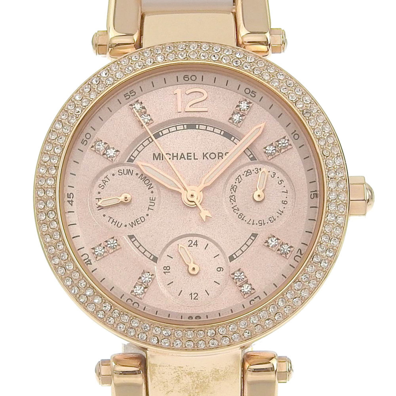 Michael Kors Wristwatch: Michael Kors Wristwatch Stainless steel case and band, featuring rose gold accents, make this Michael Kors wristwatch a stylish addition. The quartz movement ensures accurate timekeeping, while the da
