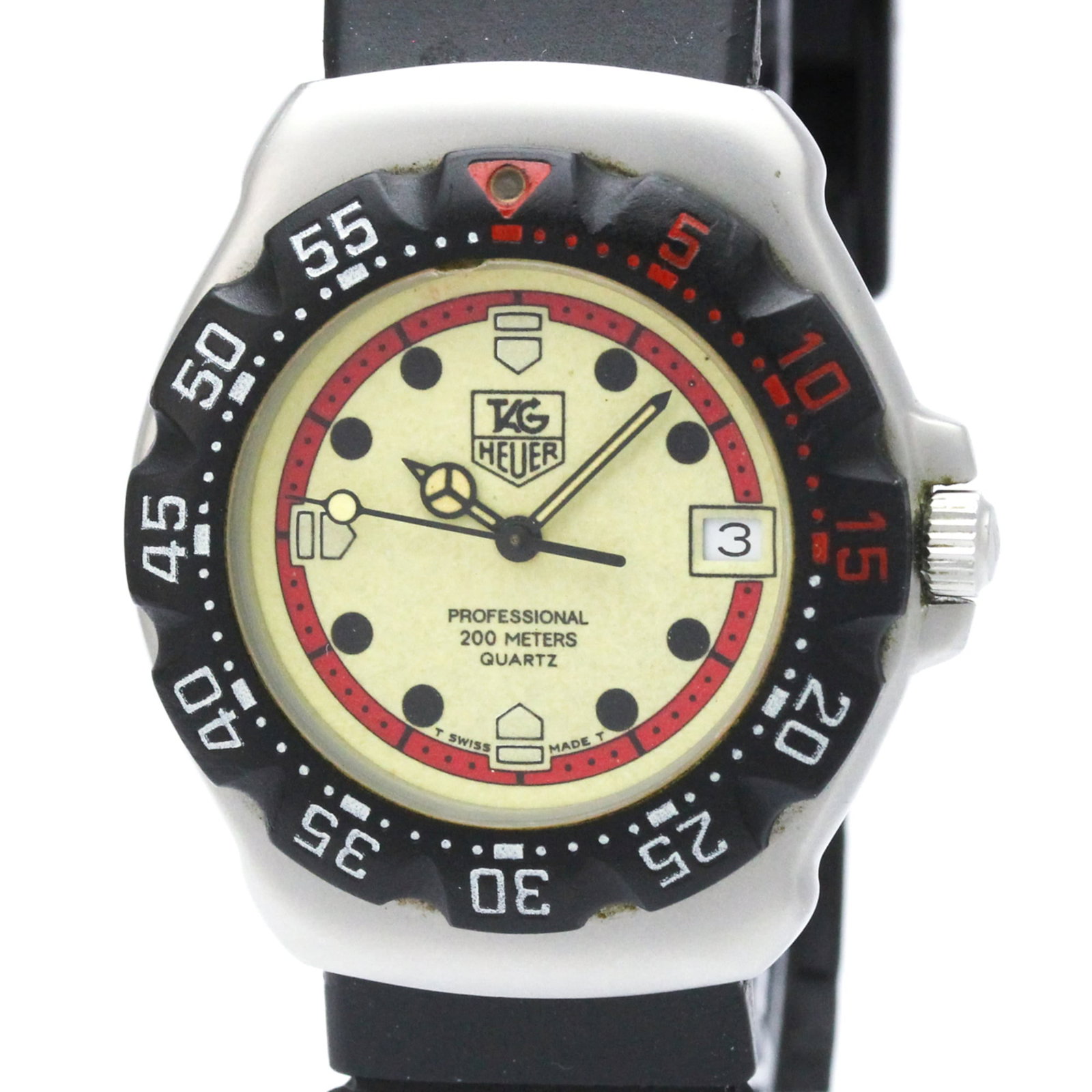 Wristwatch by Tag Heuer: Wristwatch by Tag Heuer Stainless steel case and rubber band create a sporty look, while the ivory dial adds a touch of elegance. This quartz-powered Formula 1 wristwatch features date display and