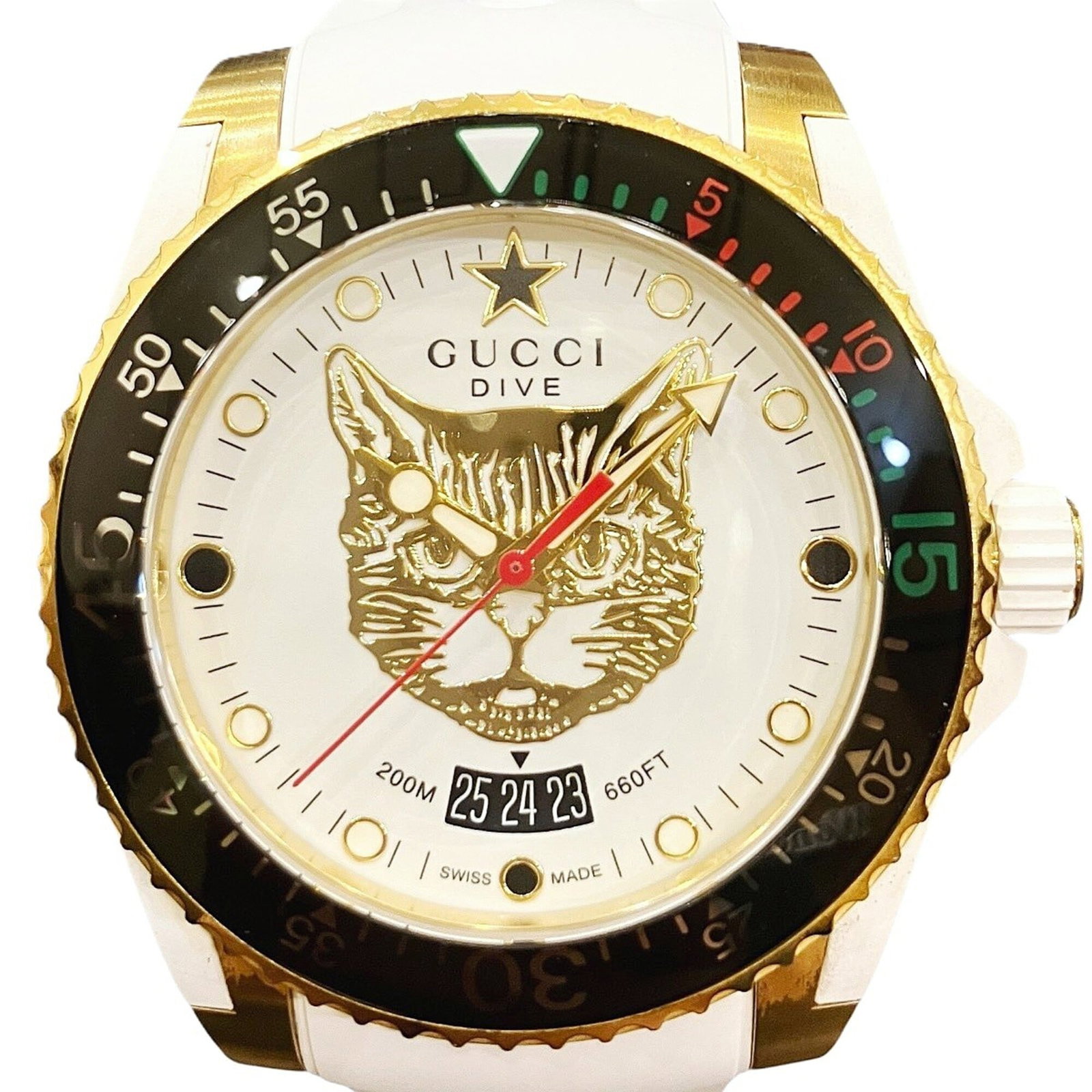 Wristwatch from Gucci: Wristwatch from Gucci Stainless steel case and rubber band provide a sleek, versatile look for men and women alike. The gold dial adds a touch of sophistication, while the quartz movement ensures reli