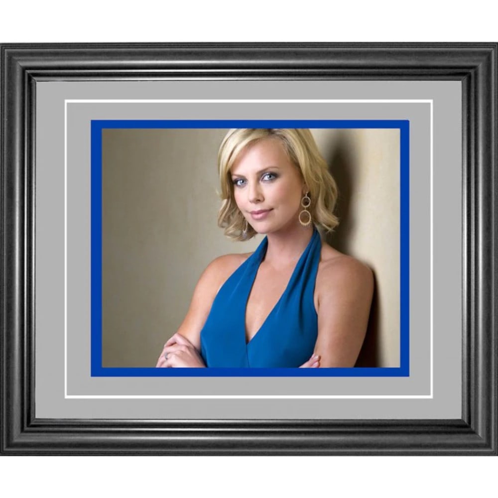 Framed 8x10 Photo By Charlize Theron: Framed 8x10 Photo By Charlize Theron Charlize Theron's 8x10 photo is beautifully framed, making it a stunning addition to any fan's collection. Packed and shipped from Dania Beach, Florida, this item 