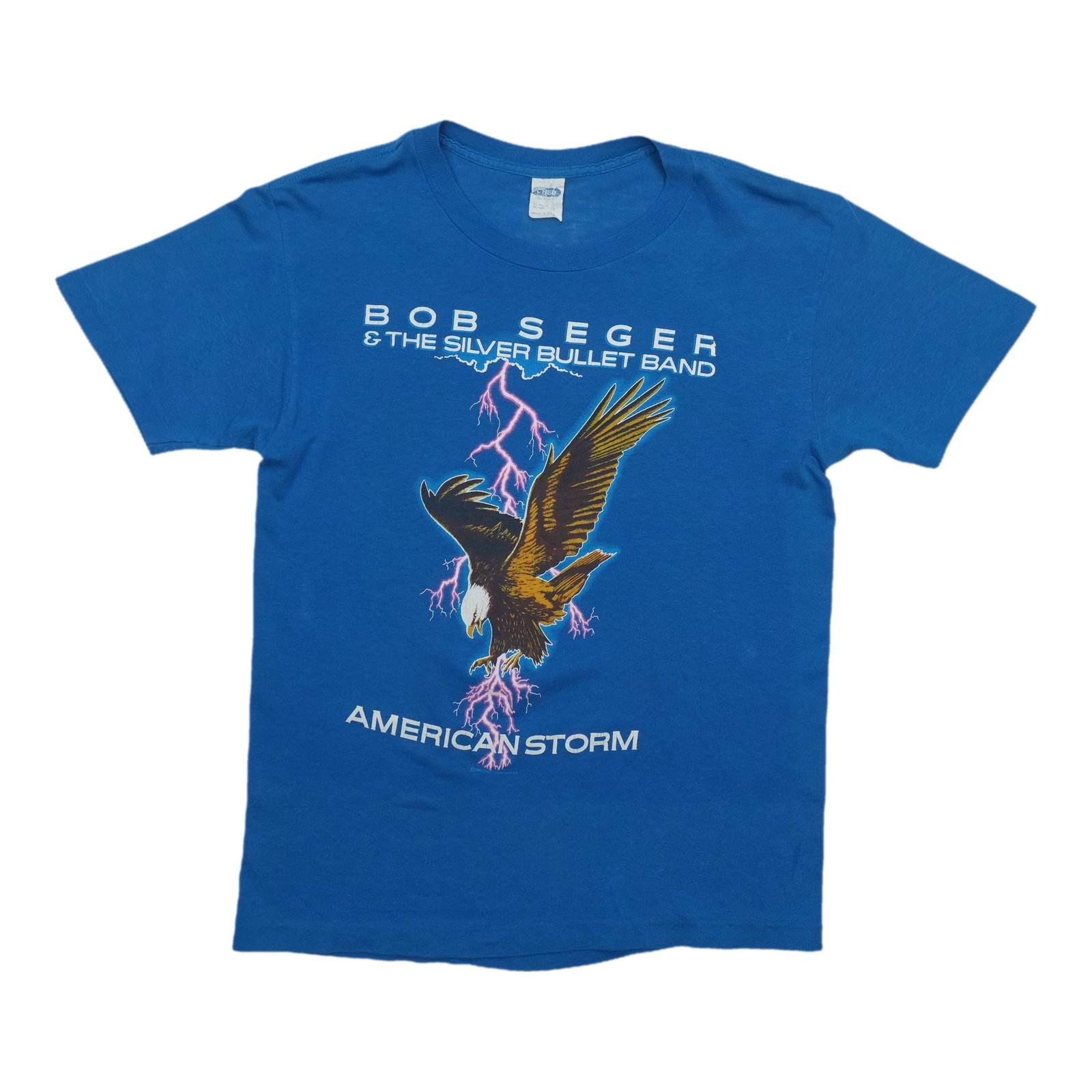 Bob Seger American 1986 Storm Tour Shirt: Bob Seger American 1986 Storm Tour Shirt Authentic Bob Seger American 1986 Storm Tour Shirt, featuring the iconic musician's name and tour logo on the front. This vintage tee has been carefully preser