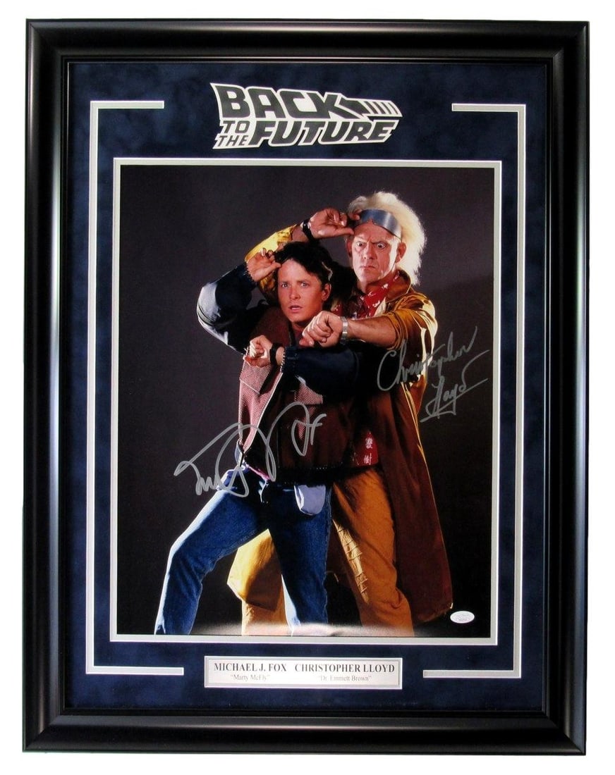 Michael J Fox/ Christopher/ Lloyd Dual-Signed 16x20 Photo Framed JSA 209915: Michael J Fox/ Christopher/ Lloyd Dual-Signed 16x20 Photo Framed JSA 209915 Dual-signed by Michael J. Fox and Christopher Lloyd, this framed photo measures 16x20 inches and bears the authentication st