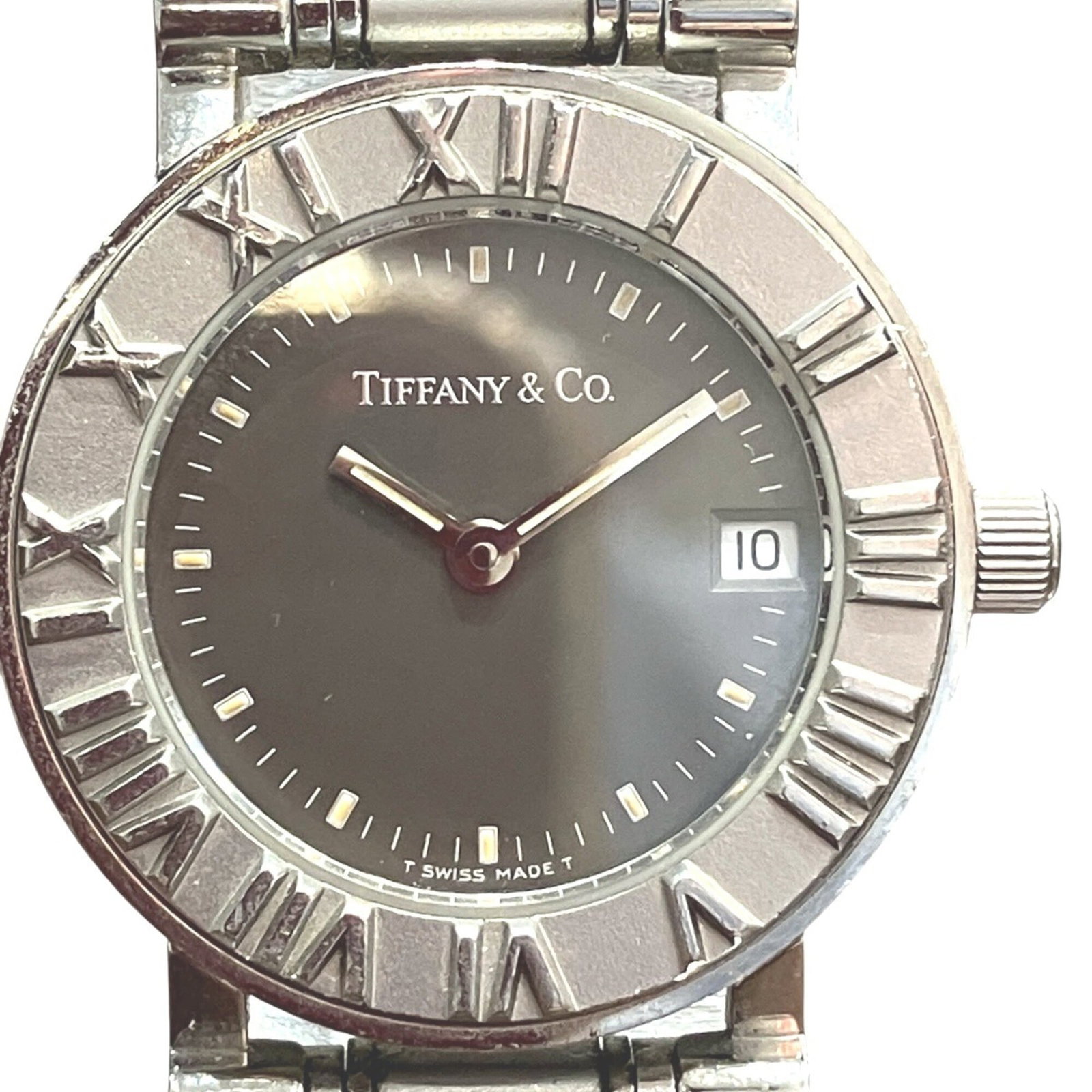 Tiffany Wristwatch: Tiffany Wristwatch Stainless steel case and band add a sleek touch to this black quartz wristwatch, measuring 25mm in diameter. The 15cm length accommodates wrists of various sizes, making it a versat